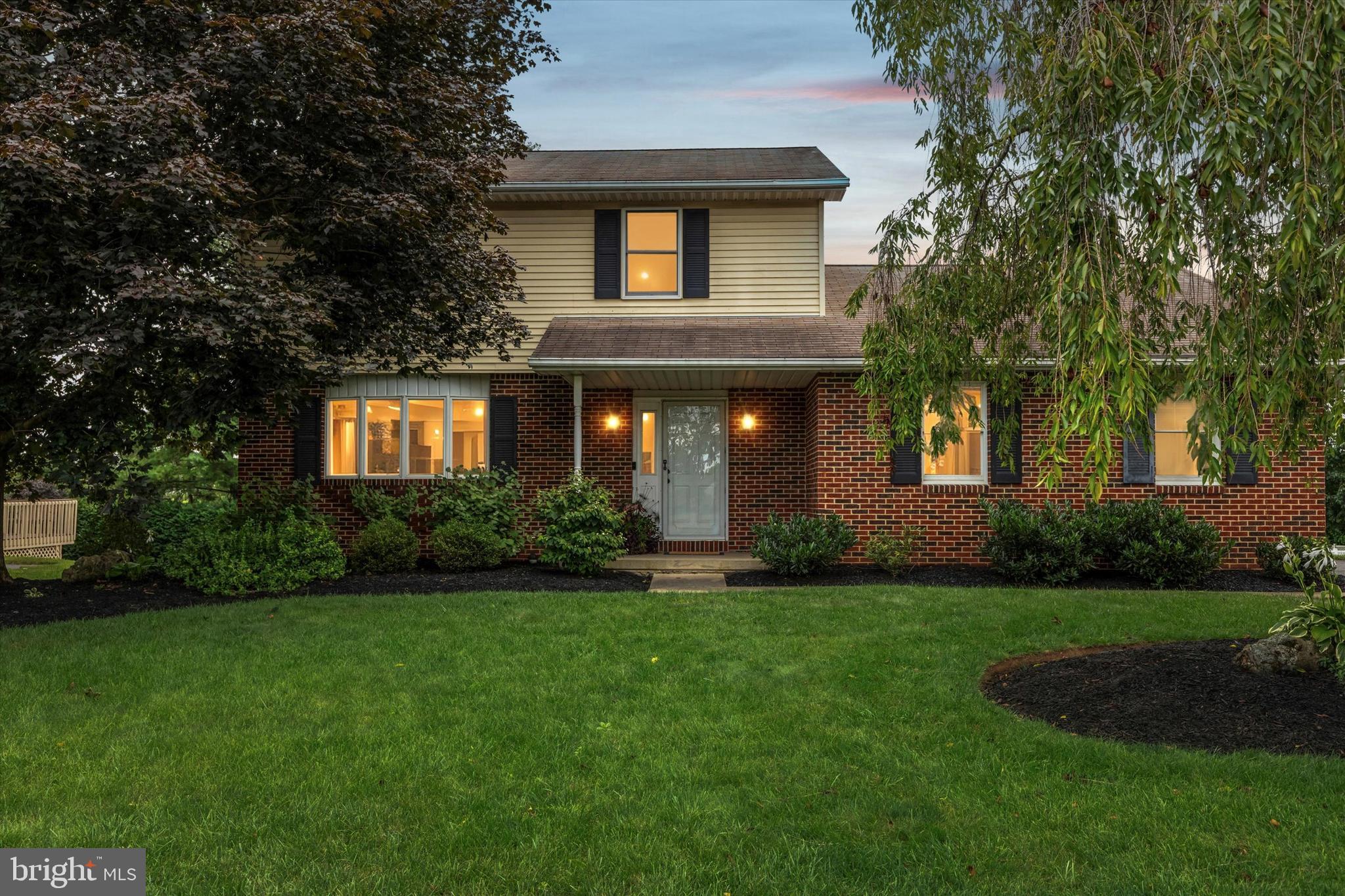 Another opportunity to live in desirable Wolf’s Run! This updated, well-maintained home blends comfort and convenience in a tranquil setting. Start your mornings with coffee on the sunny deck overlooking the yard, unwind by the crackling wood-burning fireplace, or host lively gatherings in the vaulted great room where kitchen, dining, and living spaces flow together with ease. The kitchen shines with a large island for meal prep and conversation, sleek black stainless steel appliances, and a pantry for your everyday necessities. A front room with immediate access to the entry and half bath offers the perfect home office, while French doors add charm and connection to the dining area. Indoor/outdoor living is effortless with a spacious deck, expansive yard, and a covered patio with storage and full-height walkout to the finished lower level—ideal for recreation, movie nights, laundry, and storage! A ramp from the driveway to the patio ensures easy ADA access, and the heated two-car garage plus space for four more vehicles adds everyday convenience. Upstairs, three bedrooms offer comfort and ceiling fans, including a serene primary suite with a walk-in shower and generous closet space. Neighborhood tennis courts and a playground are steps away, while shopping, dining, pools, golf, and Wegmans are minutes from your door. Commuting is simple with Routes 33, 22, and I-78 nearby, and just 12 minutes to NJ. Experience the lifestyle you’ve been dreaming of—right here in Wolf’s Run.