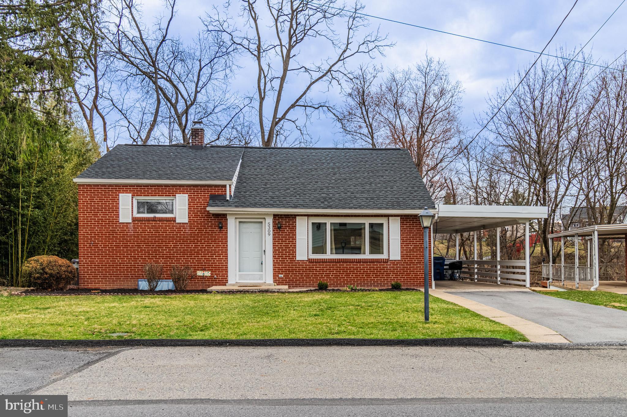Welcome to 5309 Woodlawn Drive, a charming 3-bedroom, 2-bathroom home nestled in the heart of Harrisburg. Built in 1955, this gem seamlessly blends classic design with modern comforts. The finished walk-out basement offers additional living space, perfect for a family room, home office, or entertainment area. Step outside to discover a serene, wooded backyard, providing a private oasis for relaxation and outdoor activities. This home combines comfortable living with the convenience of nearby amenities, making it an ideal choice for those seeking a harmonious blend of tranquility and accessibility in Harrisburg, PA.