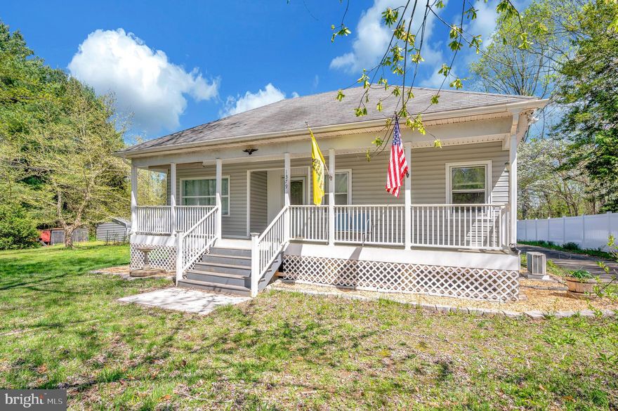 Rare find  2Bed 2Bath  home on two parcels of  land totaling 9+ acres . Minutes from Fredericksburg and Dahlgren .Commute to NOVA. Relax on the wide front porch among the abundant wildlife ;deer ,turkey ,Bald eagles and colored songbirds. Entertain on the covered back porch with adjacent large patio spaces. Enjoy a mature kitchen herb garden ,fruit vines .fig trees and flowers everywhere. Multiple outbuildings include a two car garage ,warehouse or workshop with car lift and office space ,a huge chicken coop & animal pens . Their is a climatized studio with its own porch or maybe a home classroom. There is even a RV hookup and sewer dump . The house has a enclosed screened porch back entry which leads to a mud room with a huge pantry on one side and laundry shower bathroom on the other .There is a country kitchen with a garden window. Separate dining room ,parlor , front office and  walk-up  attic loft with own climate control heat and ac using a mini split unit . Large Den that  can be used as a Bedroom . The main bathroom has a soaking tub with separate walk in shower . Tons of storage ,custom closets and built ins plus extra recreation areas.   All this with a wrap around driveway and back gated entrance . 400 ft of road frontage . New HVAC and well pump  2024   New 2025 water treatment system , New never used electric range . Must see it won't last ! Handicap accessible  .   Owners are offering a one-year home warranty