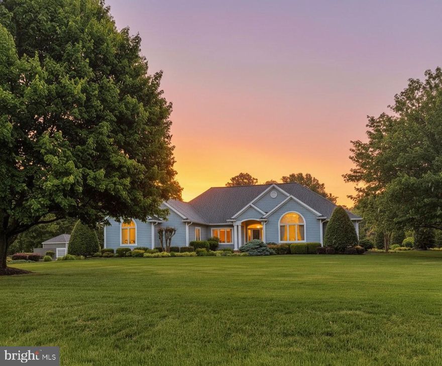 Welcome to this pristine contemporary ranch in the coveted waterfront community of South Wind on Kent Island, where luxury, comfort, and resort-style living come together on 1.21 beautifully landscaped acres. From the moment you arrive, the home’s lush green lawn, vibrant gardens, and custom walkways create a picture-perfect setting worthy of a magazine cover.

Inside, the open-concept floor plan is filled with natural light and highlighted by gleaming hardwood floors and exceptional upgrades throughout this 4 bedroom, 3 full bath estate.  The stunning designer kitchen is truly the heart of the home, featuring crisp white cabinetry, granite countertops, an oversized center island, a premium Wolf 5-burner gas cooktop flanked by custom spice cabinets, a wall convection oven, and built-in microwave...crafted for both everyday living and effortless entertaining.

Just beyond the main living areas, the inviting three-season sun porch with white tile flooring overlooks your own private backyard retreat. Step outside onto the expansive maintenance-free decking and new patio surrounding the spectacular heated gunite pool, complete with a waterfall feature and dual stair entrances, creating the ultimate outdoor oasis.

The professionally designed landscaping continues throughout the property, accented with colorful plantings, mature greenery, and thoughtfully designed outdoor spaces. A custom-built shed, designed to perfectly complement the home, offers electric service and a gated outdoor storage area.

Additional premium features include an oversized two-car garage with air conditioning, two-zone gas heat and central air, a whole-house generator, tankless water heater, updated crawlspace with dehumidifier, and energy-saving foil-wrapped attic insulation. The roof is only two years young, offering peace of mind for years to come.

Perfectly positioned to capture serene open-space and water views, this exceptional property also includes access to South Wind’s sought-after amenities, including a community beach, boat ramp, pier, tennis courts, dry dock, and more.

This is more than a home...it’s a private Kent Island retreat designed for exceptional living.