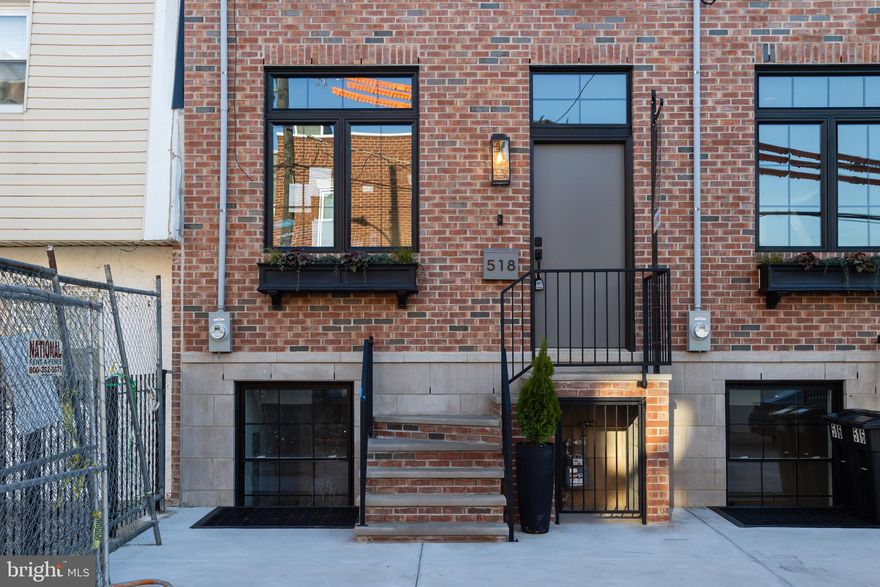 ** Ask for VIDEO TOUR and professional PHOTOS ** Welcome to your thoughtfully crafted new construction home, in Fishtown.. 1 YEAR WARRANTY included. Ask about the 10-YEAR TAX ABATEMENT! This spacious home sits on a 18’ wide and 107’ deep lot, offering 3 bedrooms, 3 full bathrooms, and two bonus rooms—perfect for guest accommodations, an office, or a gym. The design blends classic Philadelphia charm with modern elements, featuring premium earthy finishes. Among its contemporary amenities are multiple private outdoor spaces, a 65' rear backyard, and ample storage. This location is prime for you to enjoy everything Fishtown has to offer. Explore a variety of restaurants, bars, shops, cafes along Frankford and Girard Avenue. The waterfront is just a quick walk away, providing more parks and entertainment options. You’ll also find a wealth of dining and entertainment in Northern Liberties and Old Kensington nearby. Less than a block’s walk is Adaire Elementary School, along with the Fishtown Recreation Center, Community Library, and Lederer Pool. Plus, you’re close to Fishtown Montessori School, PlayArts, and a sprayground. For easy commuting, you have quick access to Highway 95, the Ben Franklin and Betsy Ross Bridges, Philadelphia International Airport, and the Market-Frankford Blue Line, which connects you to Old City, Center City, and other areas. Complementing this desirable location are the classic exterior features of the home including a red brick facade and black double casement French windows beneath a stylish black cornice. An elevated front entrance enhances privacy for the main living level. Inside wide plank French oak floors spread across an open layout connecting the living and dining areas to the gourmet kitchen. Desirable natural light consumes the entire home from the front and rear. Soft recessed lighting and curated fixtures throughout offer versatile options, from bright and functional to warm and ambient. For added efficiency, this home is furnished with two HVAC systems. Designed for both functionality and aesthetics, the kitchen features GE Café appliances, a 36” professional gas range, and quartz countertops with matching backsplash. Mounted over the oven is a custom 36” hood flanked by soft lighting sconces and a long spice shelf. The kitchen island offers a deep sink and a place to sit or prep. Ample cabinetry, including three built-in pantries and a closet with opaque glass doors, ensures optimal storage. Through the sliding doors, the spacious 65’ back yard is perfect for outdoor dining, a large garden, and an area for pets. The finished basement provides additional living and storage space including two separate rooms each with their own closets and egress. In the hall, a full bathroom is finished with an Italian tile walk-in shower with bench and oak vanity. Leading upstairs, the oak staircase is well-lit by recessed tread lights. There are two bedrooms on this floor, including a walk-in closet in the front room. All bedrooms above grade have generous windows allowing in plenty of natural light. The hall features a full bath finished with Italian tile, a deep-set tub and shower, textured porcelain floors, and a double sink oak vanity. Additional features include a built-in laundry closet and a separate linen closet. On the third floor, the primary suite showcases french doors leading through the custom organized closet into a spa-like bathroom. Double doors open to an oversized 71” soaking tub against a full wall of Italian tile. The bathroom also features a tiled walk-in shower with bench, separate toilet room, double sink vanity, and a linen closet. Enjoy stunning unobstructed views of the Philadelphia skyline from your spacious roof deck. Buyers are responsible for verifying taxes and square footage.