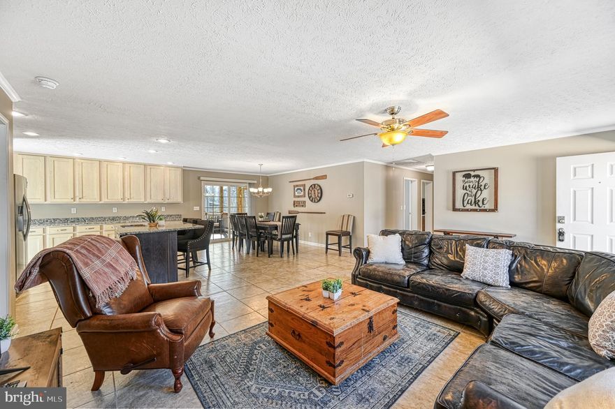 With summer just around the corner, now is the perfect time to make your lake living dreams a reality! Nestled in the sought-after Jerdone Island Community on the Private Side of Lake Anna, this water-access home offers the ultimate blend of relaxation and recreation. Just a short stroll (a 4-minute walk) from the gated waterfront common area, this property includes an assigned deeded boat slip—making lake days effortless.

Built in 2017, this thoughtfully designed home sits on nearly one acre and boasts four bedrooms, two full baths, and over 1,700 square feet of finished living space. The open-concept floor plan seamlessly connects the living room, kitchen, and dining area, creating a warm and inviting atmosphere perfect for entertaining. The well-equipped kitchen features stainless steel appliances, granite counters, and a center island, ideal for meal prep, casual dining, or gathering with friends and family. Just off the dining area, a 16x14 screened-in porch invites you to sip your morning coffee while enjoying the peaceful surroundings.

The primary suite is complete with a large walk-in closet and an en-suite bath for added comfort. The three additional bedrooms are spacious and bright, offering plenty of room for family and guests.

Outside, the 24x36 detached two-bay garage provides ample storage for cars, boats, or lake toys, with a large lean-to on the side that can also fit a boat. Whether you’re relaxing on the screened porch, roasting s’mores by the fire pit, or spending the day on the water, this home is designed for effortless enjoyment.

Jerdone Island is a golf-cart friendly community that offers a well-maintained gated common area with a large gazebo, picnic area, sandy beach, horseshoe pits, boat ramp, and boat slips—everything you need for lakeside fun! Conveniently located just five minutes from the popular El Gran Patron Mexican Restaurant at Pleasants Landing and a short drive from shopping, breweries, wineries, and local attractions, this home provides the perfect balance of tranquility and convenience.

Don’t miss your chance to own this incredible Lake Anna retreat—schedule your private tour today!