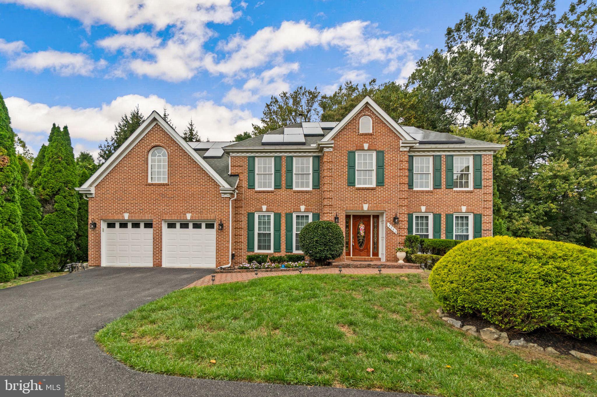 Exquisite 4-Bedroom Retreat Backing to Woods! Step into the welcoming 2-story foyer and be greeted by gleaming hardwood floors and timeless details throughout. The stunning eat-in kitchen showcases granite countertops, glass-front cabinetry with a built-in wine rack, stainless steel appliances including double wall ovens, and a large center island with gas cooktop. A bright breakfast room with skylights and rich wooden doors opens to a spacious deck that spans the length of the home—perfect for entertaining or quiet evenings surrounded by nature.
The 2-story family room impresses with skylights and a dramatic floor-to-ceiling brick hearth fireplace, while French doors lead to a sun-filled vaulted sunroom framed by windows and deck access. Formal living and dining rooms with crown molding add elegance, and a main-level office with built-in bookshelves offers the perfect work-from-home space. A convenient half bath completes the level.
Upstairs, the landing overlooks both the foyer and family room, with four spacious bedrooms including a luxurious owner's suite with a large walk-in closet and spa-inspired ensuite featuring dual vanities, a soaking tub, and separate shower. A second bedroom with a private bath adds flexibility, while a full hall bath serves the others.
The fully finished lower level expands your living space with a wet bar, full bathroom with double vanity, full-size windows, and a walkout to the backyard—ideal for gatherings, a home gym, or media room.
Additional highlights include a 2-car garage, solar panels, beautifully landscaped grounds with hardscaping and patio, and a private wooded backdrop for a serene setting. This home combines elegance, comfort, and modern amenities in a truly stunning location.