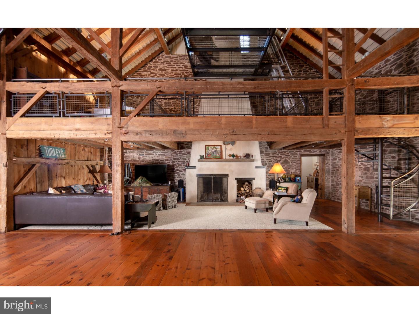 Sheep Hole Farm is one of the last remaining family compounds that offers magnificent and varied architecture, extreme privacy, recreational facilities; all sited on 82 vista strewn elevated acres. The main structure, once the original barn, went through a strenuous renovation creating a multi-level dwelling offering large and exciting open spaces and private family gathering places. A huge stone fireplace is the nucleus of the Great Room and open kitchen. There are multiple bedrooms, baths, a guest suite, theater room, and a motorized seat that elevates you into the cupola above to view even more spectacular views. This very unique structure, not only looks out at the large in ground pool, but was designed to offer an outdoor dining venue created in an over sized aviary. There is a beautiful original stone manor home with hardwood floor, fireplace, three bedrooms, two full and one half baths, offering the grandeur of Old Bucks County. This structure is currently used as a guest house and offers an exciting alternative to the more contemporary barn. The property contains a professional tennis court, youngsters' cottages with electric, hidden throughout the woods, electric car charging station and scenic walking trails. Sheep Hole Farm has been in the hands of the current Stewards for many years and now it becomes available for those who seek only the finest in a country retreat. Note: An additional 12-acre parcel with a second, mid-century guest house is available and contiguous with the main estate.