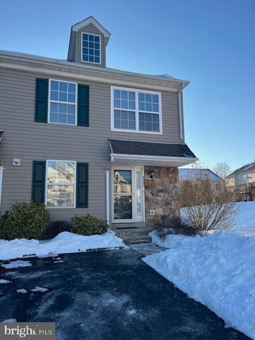 Updated and Move-In Ready!  This sparkling, fully updated 3-Bedroom END-UNIT townhome is now available in the desirable Patriot’s Ridge community—and it truly has nothing left to do but unpack. With a low monthly HOA of just $145, you’ll enjoy easy, maintenance-free living from day one. The sunny, open layout features engineered hardwood throughout the first floor, a beautifully updated Gourmet Kitchen with granite countertops, classic subway tile backsplash, and stainless steel appliances — perfect for everyday living and casual entertaining. A charming pass-through window opens to the generously sized Dining Room with a custom chandelier, creating a warm and welcoming space.  The light-filled Family Room offers a cozy stacked-stone gas fireplace and sliding doors that lead to your private deck overlooking open green space — ideal for relaxing or hosting friends.  Upstairs, the Primary Suite includes an updated ensuite bath and walk-in closet. Two additional well-sized bedrooms, a freshly updated hall bath, and convenient second-floor laundry with newer washer and dryer complete the level. Need more space? The finished basement with two large windows is perfect for a home office, gym, or movie room, plus an unfinished area provides excellent storage. Enjoy true maintenance-free living — the HOA covers exterior maintenance, lawn care, snow removal, trash, and common areas. Located just minutes from Historic Doylestown Borough, Peace Valley Park, major highways, and served by Award-Winning Central Bucks Schools.  Updated, move-in ready, and stress-free...just bring your furniture and start enjoying your new home!   ***Professional photos will be uploaded on Friday, 2/6.