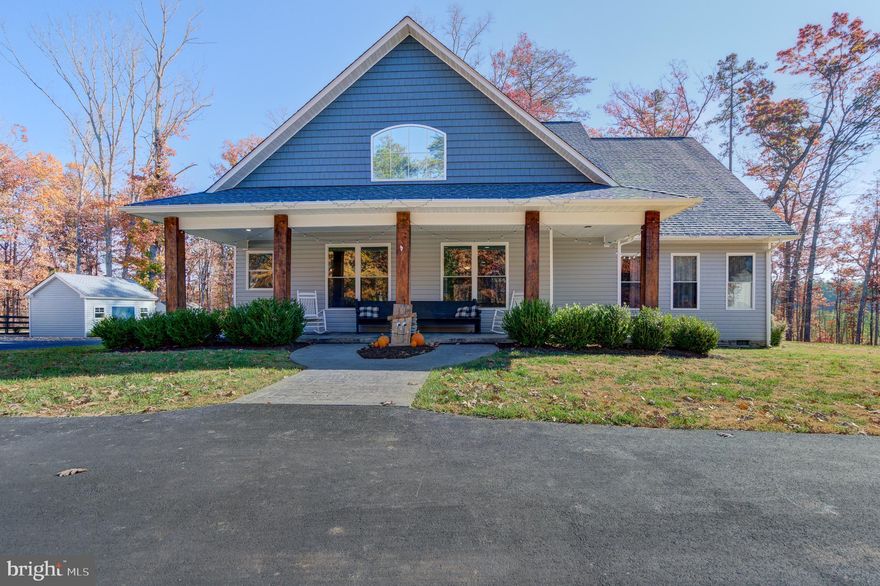 Escape reality when you slip into this cozy lake oasis in the heart of beautiful Lake Anna, Virginia.  Situated in the highly desirable Tall Pines Subdivision, on the public side of Lake Anna.  This refined craftsman style lake house has its very own assigned boat slip #78 in the subdivision's waterfront common area, which offers a sandy white beach, picnic areas, swimming areas, gazebos, boat ramp and more.  3 bedrooms, 2 full baths and a bonus room that could be used as a 4th bedroom or office (3 bedroom septic).  Inside, the main level showcases beautiful LVP floors and is upgraded and open, perfect for spending quality time with family and friends.  In the living room you'll enjoy a stone gas fireplace; the room seamlessly attaches to the upgraded kitchen, which features pristine granite countertops, stainless steel appliances, center island, spacious white soft close cabinetry, and recessed lighting.  There is also a family room that has sliding doors to the covered back porch.  Spread out in your main floor primary suite with his and her walk-in closets and a sliding door to your own private covered porch and gorgeous ensuite bathroom with separate vanities, walk-in shower and soaking tub.  Upstairs features a large finished room that makes the perfect 4th bedroom or home office. 
 Unwind in the evenings in the built-in hot tub or enjoy BBQ's on the back patio.  Two car attached  garage, paved driveway and the shed conveys!  This home sits on a beautiful corner lot and is in a great central location on the lake close to groceries, restaurants, breweries and more!  INVESTORS: Lake Anna was recently named the nation's TOP short term vacation "beach" rental location, and this property would make a fantastic investment asset.  Tall Pines does permit short term rentals.  Come see for yourself and fall in love!