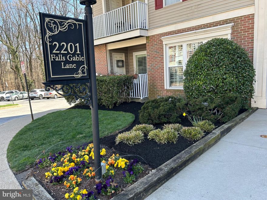 Beautifully updated first floor, NO STEPS, corner unit in sought-after Falls Gable Community.  This 2 bedroom, 2 bath was totally updated in 2022 with new hot water heater and HVAC.  High end stainless appliances and granite counter tops enhance the eat-in kitchen.  All windows and sliding glass door have been replaced with energy efficient vinyl clad windows.  Seamless Luxury vinyl flooring throughout allows for an easy flow.  The laundry room with an oversized stackable  washer and dryer provides extra storage space.  The custom plantation shutters add elegance and privacy.  The two walk-in closets as well as the outdoor storage closet provide an abundance of storage.
Enjoy morning coffee or evening drinks on the private porch/patio off the large living room with gas fireplace.  Assigned parking is steps away.  Bring your bathing suit and spend the summer at the pool.