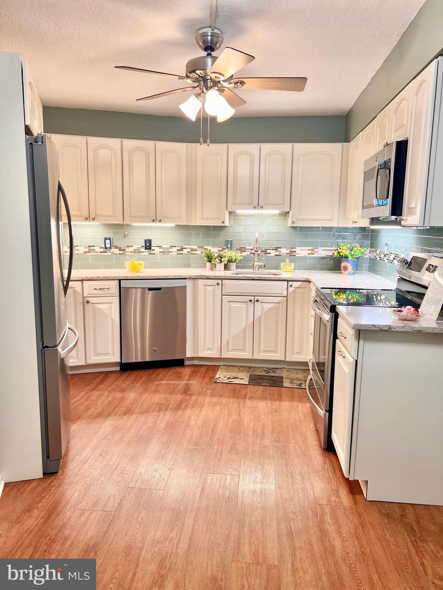 55+ Gated Community - Beautifully updated “J” Model with 2 bedrooms, 2 baths, which includes a garage space off the lobby level (4-85) and a storage cage (#229).  The table space kitchen is remodeled with quartz countertops, stainless steel appliances, white cabinetry with soft close drawers and undercabinet lighting too!  The baths have been remodeled too! The large, enclosed balcony off the living room is also accessible from the 2nd bedroom.  Freshly painted and the recent carpet has just been cleaned.  Large rooms and comfortable living await!  The monthly fee includes both the condo and HOA fees, water/sewer, basic cable TV, Wi-Fi and the wonderful community amenities.  It's resort living – with 2 clubhouses, a fitness center, indoor and outdoor pools, walking trails, tennis & pickleball courts, game rooms, 18-hole golf course, restaurants, clubs, activities, and much, much more!  And the grounds are so beautiful with abundant green space and delightful wildlife.  Come see for yourself!