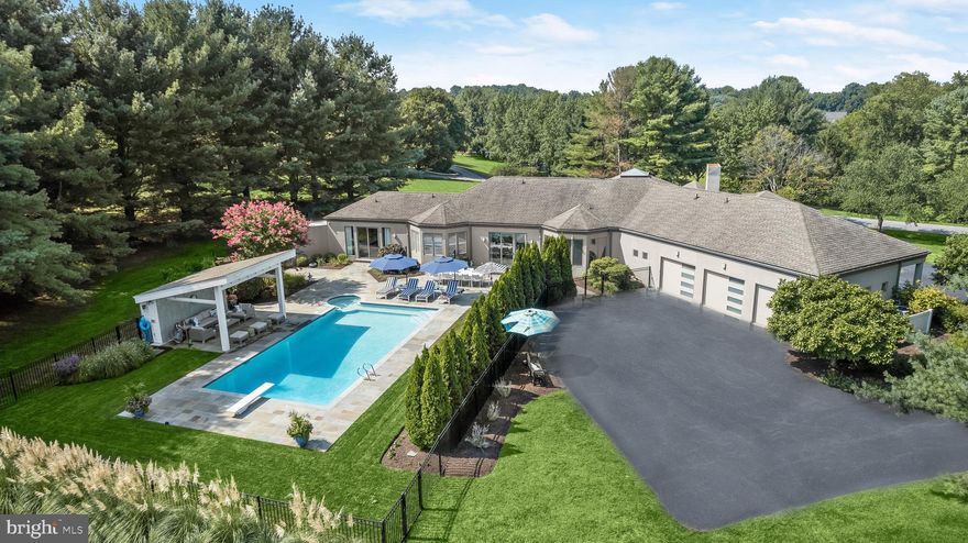 Architectural Masterpiece in Ellicott City
Designed by renowned local architect Craig L. Stewart and built by GYC Homes, this extraordinary custom residence exemplifies modern luxury rarely seen in Maryland. Nestled on 3.46 private acres, this architectural gem spans nearly 8,000 square feet of refined living space, seamlessly blending innovative design with its natural surroundings.  Lovingly maintained and extensively renovated since 2017 with improvements totaling nearly $700,000 the home offers a rare opportunity to experience resort-style living in an architecturally significant property.  From the moment you arrive, the home impresses with its bold, contemporary aesthetic and striking integration with the landscape. Thoughtfully designed to embrace the outdoors, the rear of the home opens directly onto a spectacular pool deck, creating a fluid transition between indoor and outdoor living. The primary suite is a true sanctuary, featuring a dramatic 14-foot expanse of glass with sliding doors and sidelights leading directly to the pool. The family room offers a similar connection, with a 9-foot sliding door that invites the outdoors in.  Flooded with natural light, the home is enveloped by walls of windows in nearly every room, each framing serene views of the property and enhancing the bright, airy ambiance. Two strategically placed skylights further enhance the luminous interior.  Uncompromising quality and attention to detail are evident throughout, with luxury finishes including custom black walnut flooring on the main level, solid core doors, Bespoke hardware and fixtures, and custom-designed closet systems. The front of the home spans two full levels of above-grade living, offering versatile, light-filled spaces for entertaining or relaxation.  Perfectly situated in the heart of Ellicott City, Howard County's most sought-after location, this extraordinary property offers privacy, prestige, and unparalleled architectural pedigree. A rare offering for the discerning buyer seeking a one-of-a-kind modern retreat.