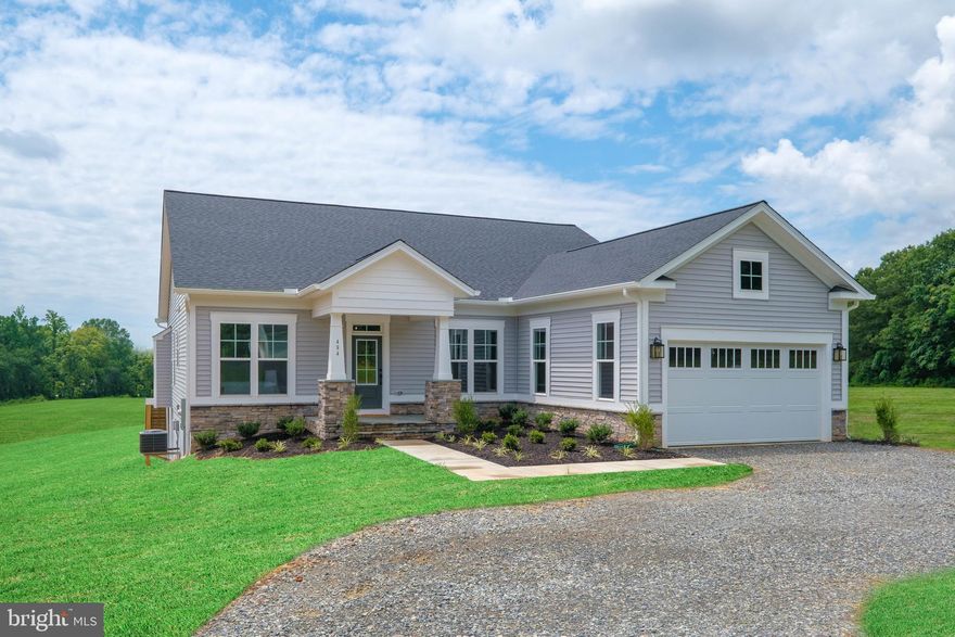 Welcome to Rock Island! Lake Anna's Newest Waterfront subdivision located on the private side of Lake Anna. This Windward L offers amazing lake views from the highest point of the community!
 
This home features a deluxe kitchen equipped with stainless steel appliances, beautiful white cabinets and upgraded quartz countertops throughout the entire home. Gorgeous hardwood floors cover the main living area. Large open family room with gas fireplace and large windows and doors overlooking as you perch above Lake Anna. On the main level you will find the owners suite with glass doors opening up to the rear deck and a large walk-in closet. The master bathroom comes with tiled floor, a shower with glass doors, and a beautiful free-standing tub to unwind in after a long day at the lake! This open floor plan also features a spacious master suite, 2 additional bedrooms, and a formal study all on the main level. The rear of the home overlooks the stunning views of the lake with a large custom deck off of the walk out basement. Finished lower level offers another Bedroom, full bathroom, and media room. Walk-out doors open to rear yard and great lake views! Covered Boat Slip Included!