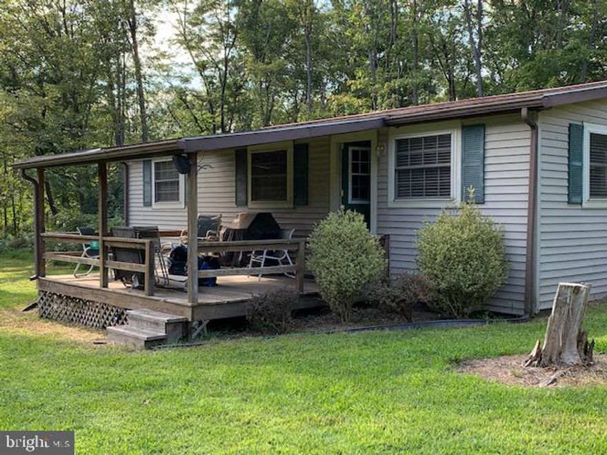 2 Bedroom 1 Full bath fully furnished cabin/mobile home.  The cabin is located near private hunting grounds, State Game Lands, and State Forest. There is a 99-year renewable lease - $325/year. Well and Septic. The private road is maintained and the grass is mowed. The Lease provides for about 1 Acre surrounding the home.  This is to be used as a recreational only, no permanent residence.