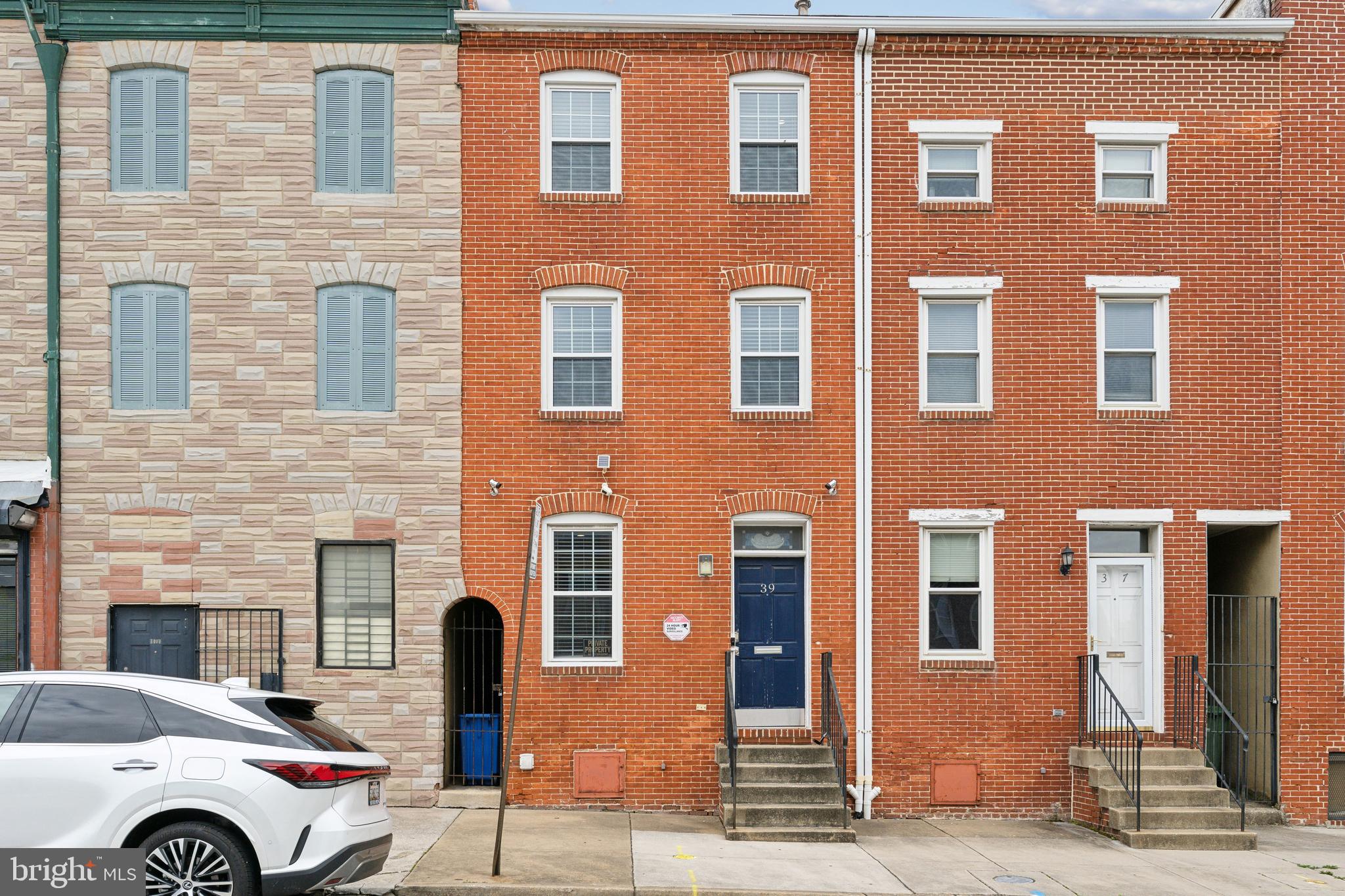 GORGEOUS 3-STORY ROW HOME ON QUIET AND SOUGHT-AFTER BLOCK NOW AVAILABLE IN UPPER FELLS POINT. GLISTENING HARDWOODS CASCADE THROUGHOUT. CUSTOM CABINETRY, LARGE CHEFS KITCHEN, TALL CEILINGS. SPACIOUS 3 BEDROOMS WITH 2.5 BATHROOMS. 3RD LEVEL FEATURES A BEAUTIFUL PRIMARY SUITE WHICH INCLUDES A WALK-IN CLOSET AND A PRIVATE DEN. TONS OF NATURAL LIGHT. EXPOSED BRICK. CUSTOM BACKSPLASH AND BLINDS THROUGHOUT. EXTERIOR HOME VIDEO SURVEILLANCE. AMPLE STORAGE. LUTRON LIGHTING SYSTEM WITH DIMMERS THROUGHOUT. ENERGYSTAR WINDOWS. FULL-SIZE WASHER & DRYER. PRIVATE REAR FENCED IN PATIO - GREAT FOR ENTERTAINING. 1 OFF-STREET PARKING SPACE AVAILABLE IN THE REAR COURTYARD. CLOSE PROXIMITY TO RETAIL SHOPPING, LOCAL DINING, FELLS POINT, INNER HARBOR, PATTERSON PARK, AND ALL MAJOR HIGHWAYS. SCHEDULE A PRIVATE TOUR TODAY.