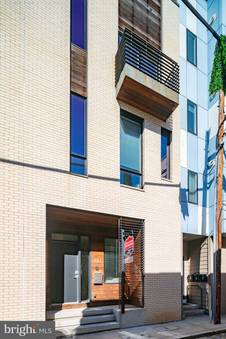 Welcome to desirable Northern Liberties and the charming Cobblestone Street of Wallace. This 4-bedroom 3.5 bath corner townhouse checks all the boxes. Enter into a spacious and open floorplan which consists of a generously sized living area and a chef's kitchen with built-in stainless-steel appliances, quartz countertops, and a large island which is great for entertaining. For all work -out Phanatic's the basement is completely finished and makes a very nice personal gym and is even large enough to include your home office.  Bedrooms are all very nicely sized with great closet space, the master bedroom is located on the 3rd floor and offers a grand closet and gorgeous tiled bath.  One more flight of stairs will take you to the 4th bedroom and the gorgeous outdoor deck to relax in the evenings and enjoy the views. Best of all this residence offers one assigned parking space directly off the patio area in the Community's private lot.  This property still has app 18 months remaining on the tax abatement. Don't miss out on this one and all the great restaurants and coffee shops that Northern Liberties has to offer.