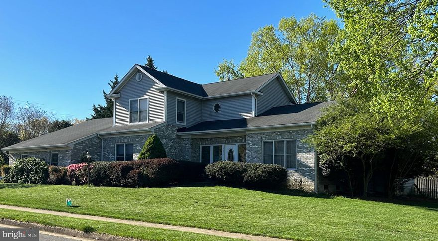 Welcome to this beautifully maintained custom-built home, architect owned and designed with four bedrooms and 3 ½ baths conveniently located close to Tyson’s Corner, the Metro, and easily accessible to all major thoroughfares.  Imagine living on a beautiful almost 1/2 acre appointed corner lot that provides privacy in an otherwise congested area.  Enjoy the backyard with natural tree-lined privacy fencing where you can enjoy sitting on the deck with a morning coffee or unwind after a long day.  Once inside, you will appreciate the open-concept living area with a large kitchen with white cabinets and granite countertops that flows into a great room that is perfect for entertaining.  Unique to this property is a main-level primary suite with lots of closet space and an ensuite with a shower and soaking tub.  An additional room found on the main level is the perfect space for an office or 4th bedroom. Upstairs you will find 2 generously sized bedrooms with an additional full bath. Explore the fully finished walk-out basement with another full bathroom and plenty of space to create your own living experience. Also included on the lower level is a workshop and utility area with plenty of shelving.   Updates include new carpet (2023), roof (2013), insulation (2021), Carrier AC Unit (2018), Carrier Furnace (2015), Radon Abatement System (2021), and Washer/Dryer (2020).