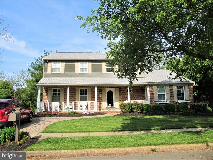 A spacious covered front porch greets you as you approach this lovely  colonial located in the charming community of Linthicum Heights!  This 4 bedroom home  has the potential for 6 bedrooms.  The  in-law suite on the first floor could easily be a 2nd primary bedroom with it's own full bath and sitting room.  The primary bedroom on the 2nd level includes a huge separate sitting room which could have many uses; office, gigantic closet, work-out room; whatever suits your needs, or could easily be converted to an additional bedroom.  The finished basement with walk out to a covered patio offers an office (6th bedroom?), half bath, bar with wet bar and lots of room for entertaining!  The kitchen and all baths have been updated with the exception of the half bath in the basement.  Beautiful sunroom addition overlooks a park-like setting in the rear yard and accesses the maintenance-free deck.  The windows and the siding have also been updated and the the roof is approx 1-1/2 years young!