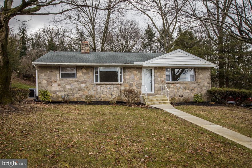 This 3 bedroom, 2 and a half bath stone single in the OLEY SCHOOL DISTRICT / ALSACE TOWNSHIP has been completely remodeled from top to bottom and is absolutely stunning!  Situated on a large, corner lot with mature trees and a private rear yard, this home has a long, paved driveway for plenty of off-street parking leading to an attached 1 car, heated garage. Enter into the main floor of the home to an open and airy space with vaulted ceilings in the living and dining rooms and gorgeous laminate flooring. The 25 handle eat-in kitchen features newer white cabinets, quartz countertops, tile backsplash, recessed lighting and newer stainless appliances. The open wall between the kitchen and dining room provides that combined room feeling to enhance your entertainment space when spending time with family and friends. Step up a few steps to the second level featuring all new carpeting, a large master suite with a ceiling fan and a full master bath with a walk- in tiled shower and tile flooring. Two additional bedrooms are ample in size with plenty of closet space. In addition there is a full shared bath offering a tiled shower/tub combo, tile flooring and a large linen closet.  The finished walk-out lower level is where you will spend most of your time, boasting a fabulous floor-to-ceiling stone fireplace with a new gas insert, a dual sink wet bar with mini-fridge, newer carpeting and paint, recessed lighting and an updated half bath. Step out of the sliding patio door to grill and chill, enjoy the view of the back yard and count the species of birds that will surely visit!  In addition there is a full, unfinished basement with washer/dryer hookup, utility sink, workbench and ample storage space.  This home features a newer gas heater and central A/C, a brand new gas water heater, double-hung windows throughout, 200+ AMP electric, new garage door with a quiet, belt-driven Chamberlain opener, new concrete front steps, walkway, driveway apron and rear patio.  This home is move-in ready in a convenient location on a non-through street just 1/2 mile off of rt. 12.