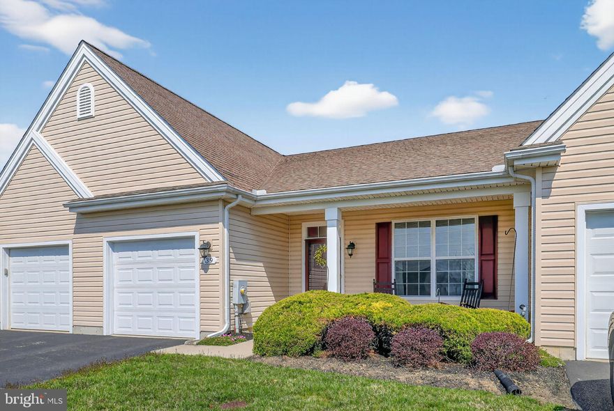 Visit this lovely 55+ carriage home, in the highly desired neighborhood of Spring Meadow. This move in ready, 2-bedroom, 2-bathroom interior home nestled in a cul-de-sac, has 1,410 sq. ft. of thoughtfully designed space. Offering an open layout with 9-ft ceilings. Stepping into the entry way, the first of 2 bedrooms, is on your right. It is well placed, adjacent to 1 of 2 full bathrooms, offering privacy to your guests. In addition, you'll find a coat closet, laundry room, mechanicals closet and a double door storage area, which can be used as an expanded pantry, or however will best serve your needs. Moving on to the heart of the home, the kitchen, with wrap around peninsula for added seating, intersects with the dining area and living space, making entertaining a breeze. As host/hostess, you'll never be far from lively conversation. The cozy living room features a gas fireplace, perfect for relaxing on cooler evenings, while the sliding door provides a view of the park-like back yard. You'll enjoy gazing out at the seasonal changes, while enjoying your morning coffee or reading the paper. The primary suite boasts a huge walk-in closet and a nicely finished en-suite bath. It too has a view of the back yard. The 1-car garage keeps your vehicle safe from the elements and/or can provide even more storage. Extra community parking for guests is conveniently located right across the street. Living in Spring Meadow means enjoying many amenities. Every day can be like a vacation. You'll enjoy the outdoor pool and lawn care in the warmer months, while snow removal helps take the sting out of the winter. Covered by the HOA, you also have access to a lovely clubhouse with gym, library, and bar. Schedule your showing today!