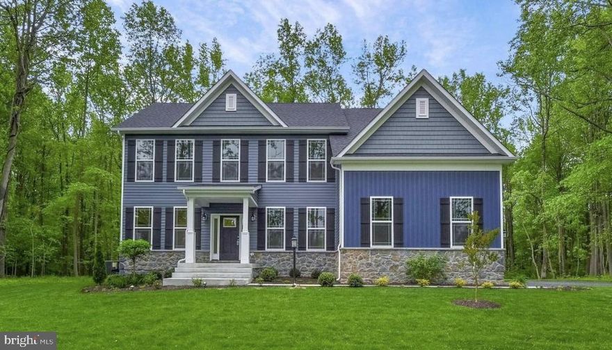 Ameri-Star Homes is pleased to offer this incredible opportunity for a to-be-built, craftsman-style home situated on a spectacular 7.9-acre homesite in a water-oriented community surrounded by the sought-after Forest Glen community in Pasadena, Maryland. Our elegant Baltimore Model is a 4 Bedroom, 2.5-bathroom home with a side entry 2 car garage featuring an upgraded exterior with stone accents, portico porch, shakes in the gables, 30-year architectural grade roof shingles, fully sodded yard with a generous landscaping package - ALL STANDARD! A home that you will be proud to drive up to. The interior of the Baltimore boasts a gorgeous rear two-story family room, a center hall foyer with formal living room and formal dining room, a private rear den/office, oak stairs to the upper level and a spectacular over-sized kitchen, kitchen island and upper-level laundry. The expansive Owner's Suite Includes a super bath with ceramic tiled shower walls and floor and a separate soaking tub, along with double vanities. This home includes all the amenities that you deserve, including sparkling granite counters in the kitchen, granite vanity tops in the primary and hall bathrooms, hardwood floors on entire main level and upper hallways of the home, a chef inspired kitchen, stainless steel appliances including a Stainless Steel range, refrigerator, dishwasher and updraft vent hood, upgraded cabinets with soft close doors and drawers in your choice of colors, a deep bowl stainless steel sink, ceramic clad bathrooms and laundry room floors, craftsman style 5 ½ inch baseboard moldings, cased windows, and openings and so much more. - ALL STANDARD! Builder is including allowances for additional upgrades to the flooring, lighting and plumbing fixtures. The Baltimore model offers plenty of room for expansion with an optional recreation room, bedroom, den, and full bathroom in the basement. Other models or plans are available. Pictures may be representative of likeness and or show optional features. Located minutes to Ft. Meade, NSA, DISA and US Cyber Command and an easy commute to Baltimore, Washington DC, and historic Annapolis. Note: Limited opportunity to lock in your interest rate for 12 months. Prices, terms, conditions, and availability are subject to change without prior written notice.