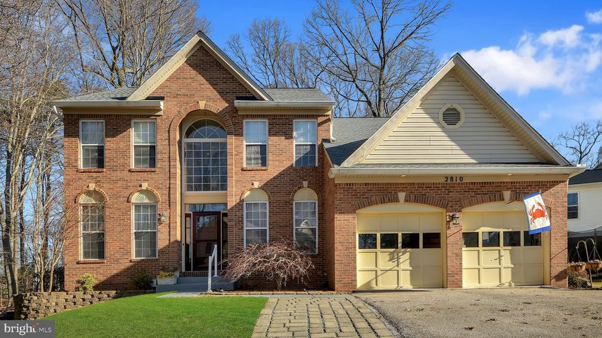 This Chapman Farm colonial is one of the biggest home and lot in the neighborhood and is on a cul de sac. You enter into this home through a two story hardwood floored foyer flanked by a living room and a dining room.  You continue on to a separate library and then to a large family room/kitchen combination.   The family room has gas stone front fireplace and a wall of windows.  The kitchen is large and bright, with white cabinets, island, new stainless appliances, and granite counters.  The master suite has cathedral ceilings, dual walk in closets, soaking tub, and separate shower.  The other 3 upper level bedrooms are nicely sized.  The basement is finished, with separate rec room,  wet bar, full bathroom, a lot of storage, and a walk up.  The wooded yard is one of the most private in the neighborhood.  This home has everything that you are looking for in a single family home in Crofton.