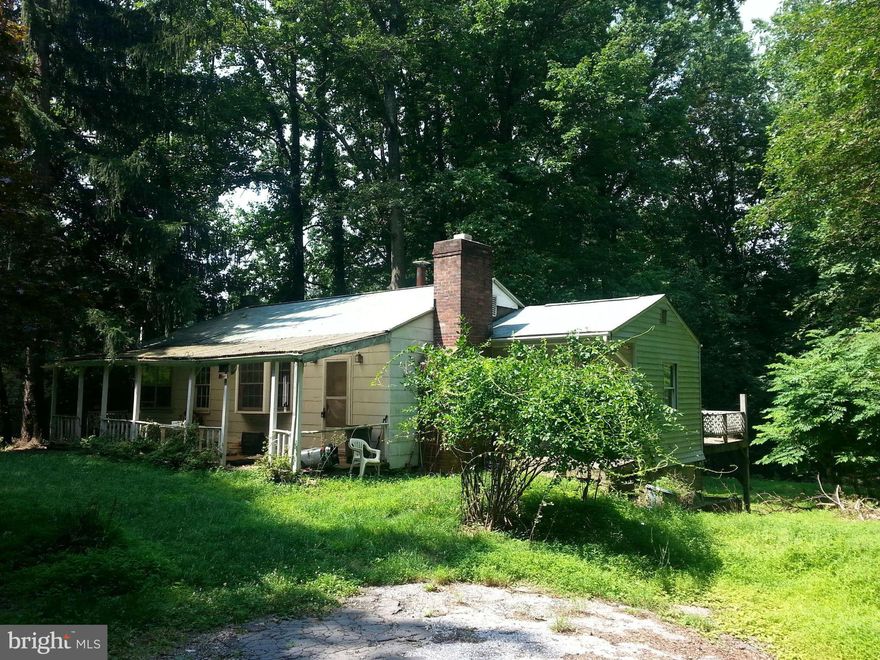 Beautiful 1+ acre lot located down a long quiet road. House being sold AS IS.   House does not have power.  Please only show during daylight and bring flashlight. VALUE IS IN THE LAND!! PLEASE bring an OFFER!! EASY TO SHOW!