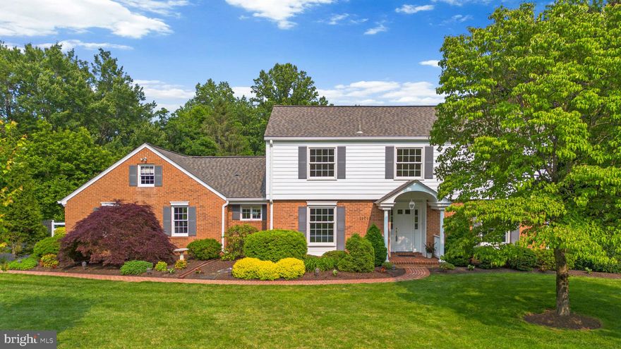 Striking brick-accented Contemporary residence nestled on over 2 tranquil acres in serene Mooresfield. Beautifully landscaped with a long private driveway, expansive front yard, a brick pathway, and mature plantings, this home offers privacy, character, and exceptional curb appeal. Thoughtfully designed for comfort and style, the interior is filled with natural light and enhanced by recent updates. The main level welcomes you with a bright and airy foyer that flows into the living room, where a wood-burning fireplace and large windows create a cozy yet refined atmosphere. On the opposite side, the formal dining room features hardwood floors and elegant wainscoting, ideal for hosting special occasions. At the heart of the home, the open-concept family room provides a spacious setting for everyday living and entertaining. French doors lead to a four-season sunroom with exterior access, extending the living space and offering serene backyard views. The gourmet eat-in kitchen, extensively renovated in 2025, blends functionality with modern design. It boasts quartzite countertops, stainless steel appliances, a center island with a cooktop and pendant lighting, a large walk-in pantry, and abundant white cabinetry—including glass-front and open shelving for added charm. A cozy breakfast room completes this inviting space. Nearby, a stylish powder room and a laundry room with rear exterior access add convenience to the main level.

Upstairs, discover four generously sized bedrooms, including a spacious primary suite with a beautifully updated ensuite bath (2025). An additional full bathroom with an oversized double-sink vanity serves the secondary bedrooms, one of which features custom built-ins.  The fully finished walk-out lower level adds exceptional livable square footage, offering a recreation room with a wall of built-in bookshelves, a second wood-burning fireplace with brick surround, a fifth bedroom, a bonus room, a photography dark room, a full bath, and a large storage/utility area.  Step outside to enjoy the expansive deck and brick patio overlooking the beautifully landscaped 2.19-acre lot that backs to mature woods and a peaceful stream with a charming footbridge. A lower-level patio provides additional space to entertain or unwind. Completing the property is a detached garage with extra storage, a pergola, and a separate shed.