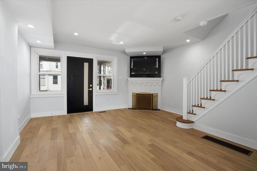 Gorgeous renovation on quaint block in East Mt Airy. Enter through the enclosed porch into a spacious living room with white oak flooring, recessed lighting & faux fireplace with mounted TV. Our kitchen absorbs plenty of natural light and features quartz counters, stainless steel appliances, ample cabinetry and a beautiful large center island with gold sink and convenient stool seating. The 2nd floor offers three bedrooms with closets in the master and middle bedroom with ceiling fans, light dimmer & mounted TV's in each. This floor also features a tasteful ceramic tiled bathroom with gold finishes & skylight.  Our finished basement features plush carpeting, recessed lighting and a potential 4th bedroom plus full three piece bath with additional access to the backyard.  Brand New electric, HVAC & plumbing plus a 12 yr warranty on new roof. Stone's throw to Germantown Av with all its stores & boutiques, 5 min to Wissahickon Park & 76 for easy access to all major arteries. Easy to show,  come & see it today !