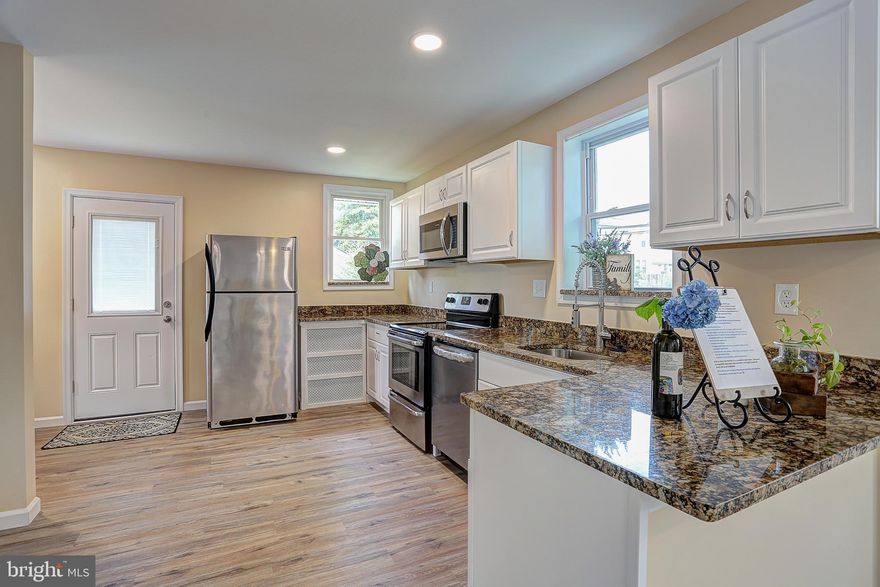 FANTASTIC,  newly renovated 4 bedroom,  2   bath in the heart of Arbutus! ENJOY this home's bright and spacious feeling! Main level features 2 bedrooms with 1 full bath & a   bath, laundry room, all new laminate flooring, stainless steel appliances, & new cabinets. The upper level offers 2 additional bedrooms, a bonus room to be used as a playroom, office, or den as well as a full bath. Property boasts a new roof and all new siding and yard offers a partially fenced area and a detached garage.  Easy to show and can close fast! Schedule your private tour today!!