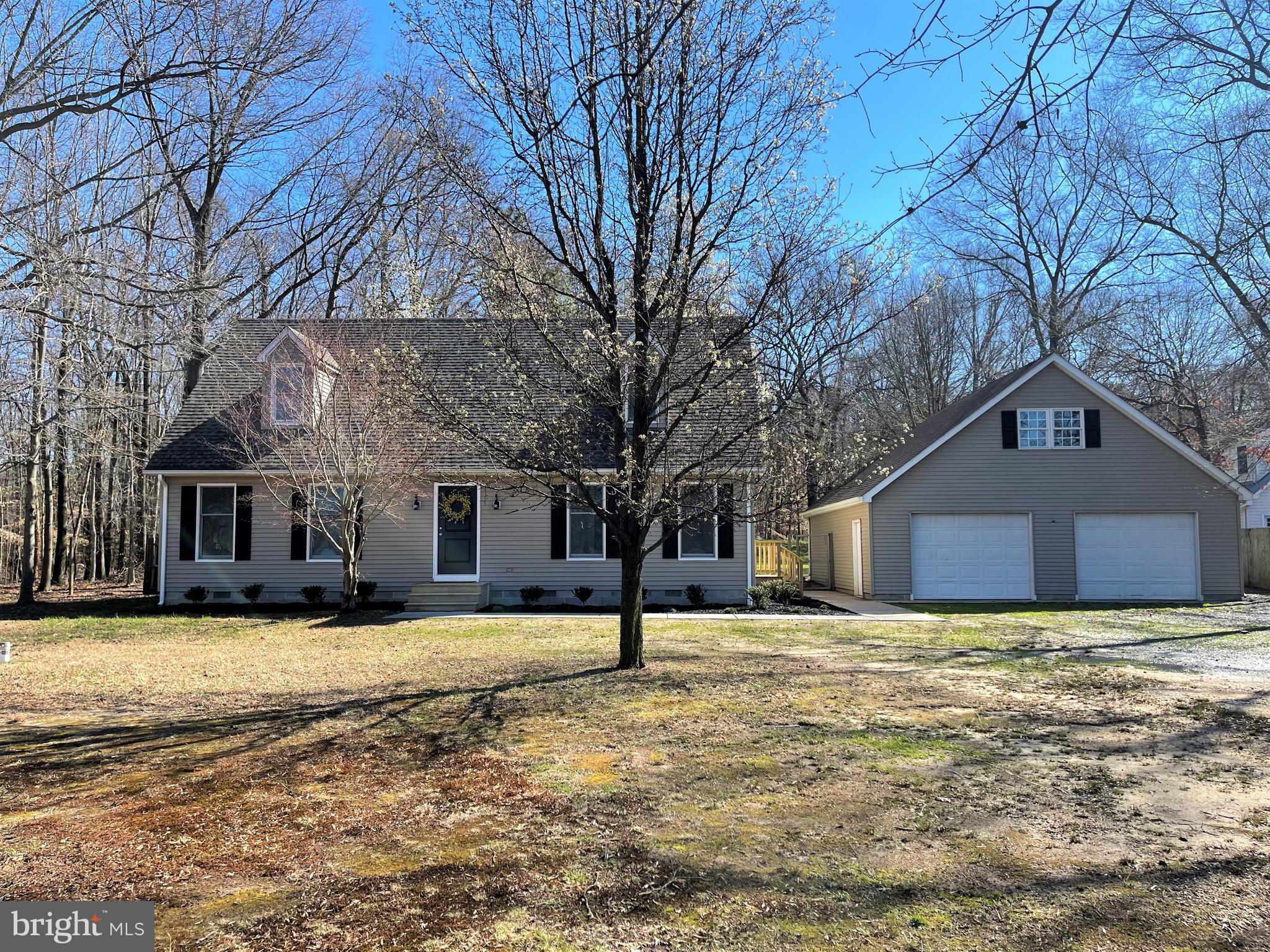 You will immediately feel at home in this beautiful, stylish Cap Cod perfectly sited on 1 acre tucked into nature. This home offers an open floor plan - living room, dining area and kitchen with SS appliances, 4 bedrooms (2 on main level) and 2 full baths....Additional highlights include large laundry/mudroom, sidewalk, new deck off back - perfect spot for relaxing/entertaining, oversized detached 2 car garage with 2nd floor storage space and ample parking. Brand new well and the roof is only 3 years old. This one is a winner!