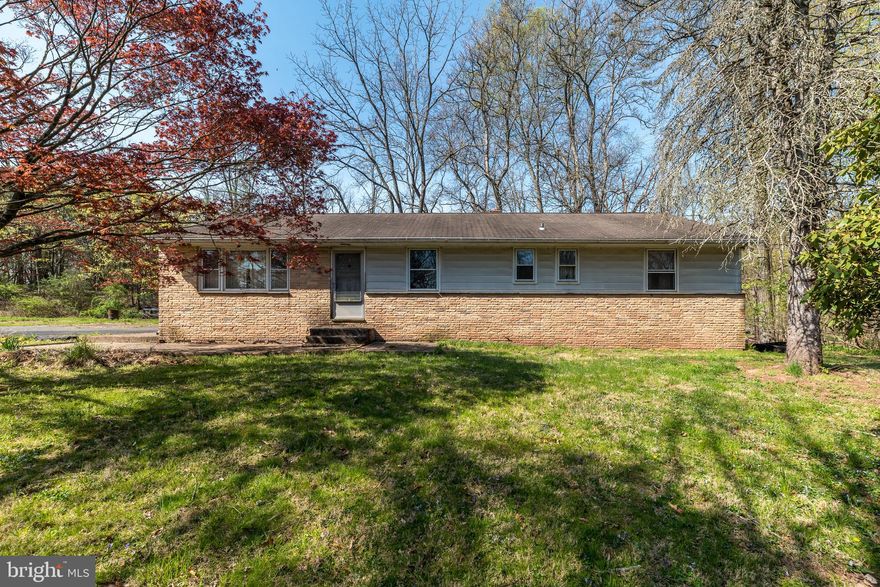 This 4-bedroom, 2-bathroom home, situated on 8.67 acres, offers a unique opportunity for those looking to invest in a large private country property with great potential. The home features a spacious full basement, a charming brick fireplace in the living room, convenient laundry chute and a central vacuum system for added ease. The highlight of the property is the bright 4-season vaulted sunroom, perfect for enjoying the views throughout the year. While the home does require some work, it provides a solid foundation to create your ideal living space. The two parcels, one 5.36 acres and the other 3.31 acres, offer plenty of space for outdoor activities, gardening, or future expansion. Bring your vision and turn this property into your dream home. With plenty of land, this is an excellent chance to bring your vision to life.