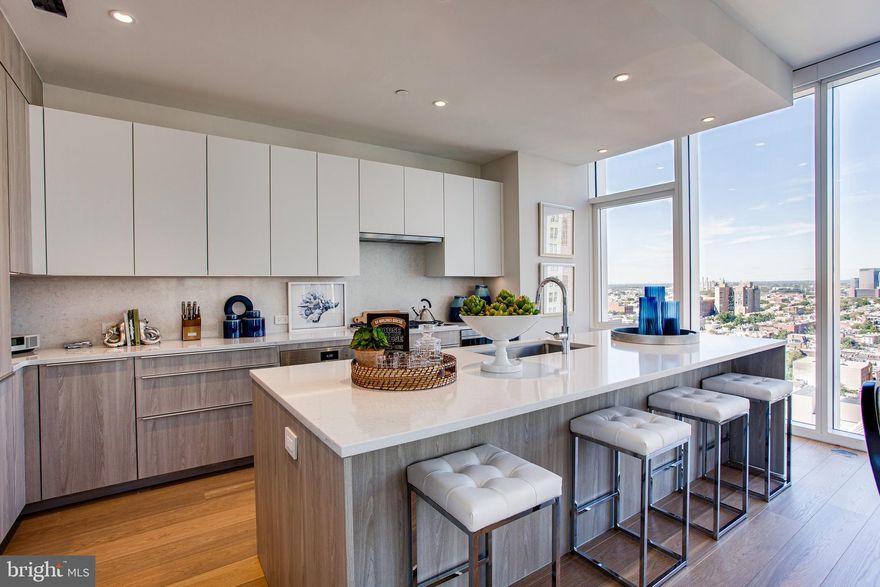 Arthaus, a commanding new residential high-rise in Philadelphia’s performing arts district, presents Unit 801:  A stunning 3-bed, 2.5-bath, 2,030 SF single-level residence with City Hall and skyline views priced at $1,985,000.  

This maintenance-free, move-in ready, home offers high-end interior design, resort amenities and white gloves services.  Tax abatement is available.  Whether you’re a busy professional, retiree or globe trotter, 801 is a MUST SEE!

Arthaus impresses from the moment you enter.  The tall solid wood door with elegant hardware sets the stage, leading to a spacious, light-filled foyer with two large closets and convenient powder room and laundry facilities.  The great room offers panoramic views of the city featuring a blended kitchen, living and dining space with soaring ceilings, floor to ceiling windows, wide-plank Havwood flooring and a weather-protected walk out balcony. Drenched in natural light this space is bright, airy, and feels twice its size on paper.

The chef’s kitchen is everything you need for hosting, with a large center island that seats four.  The upper and lower cabinets are polar white matte by Poggenpohl and the countertops Golden Gate quartz with matching backsplash. The high-end, stainless appliance package includes: Wolf, Bosch, Sub-Zero and Asko appliances and door fronts have been fully integrated into the cabinet design for a seamless look.

The primary suite and two guest bedrooms are on the north side of the condominium.   Hardwood flooring from the great room continues into the first bedroom; perfect for an optional home office. The second bedroom is a quiet retreat for visiting guests with gorgeous skyline view and walk-in closet. The full bath in the hallway is shared by the two secondary bedrooms and is finished with porcelain Calacatta tile floors, super white quartz countertops, and polar white matte Poggenpohl cabinets. The spacious Owner’s suite is wrapped in 10' floor-to-ceiling windows and features an oversized walk-in closet. A Badeloft soak-in tub, double vanity with Robern mirrors and super white quartz marble, Contempo white marble floors and shower tile, and a Kohler toilet closet complete the best-in-class bathroom package. 

Arthaus is a modern masterpiece crafted by renowned developer Carl Dranoff, designed by Kohn Pedersen Fox and built by Intech Construction.  Its architecture and amenities prioritize wellness and well-being, from the stunning Monet-inspired mosaic in the lobby to the private resort on the 6th and 7th floors, featuring a pool, fitness facilities, spa, salon, pet park, outdoor terraces, lawns, gardens and more.  White glove services include 24-doorman, concierge, chauffeured town car and car valet. 

This home comes with 1 parking license. With the 10-year tax abatement annual real estate taxes are approximately $3,367.