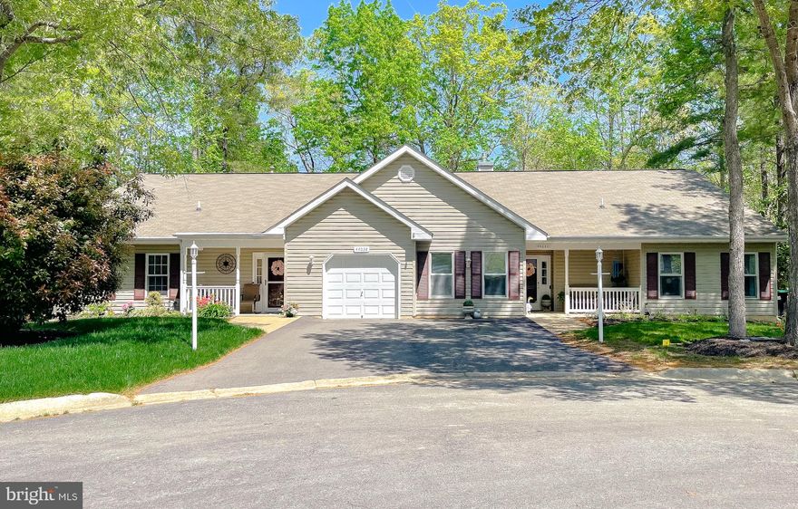 Come see this lovely duplex in the Wildewood Retirement Village, an over-55 community in the heart of St Mary's County! Beautifully appointed and maintained, with renovated kitchen and baths, recently replaced flooring, 2025 HVAC & HW heater. Welcoming front porch invites you into the living room, spacious and light, with new sliding glass doors to the patio and treed view beyond. Fabulous kitchen w/granite countertops & stainless appliances and a half-wall bar between kitchen and dining room--easy entertaining for all the new friends you'll make in this community! Owner's suite has a walk-in closet and updated bath; 2nd bedroom is nice-sized and has a walk-in closet, too. Laundry closet conveniently located on the central hallway; washer & dryer convey! Lawn & landscaping are lovely, with a sprinkler system which keeps them in prime condition. HOA dues cover lawn care, snow removal, clubhouse access & activities, trash service, mailboxes, and common-area maintenance. Great place to live, with shopping, movies, and restaurants nearby--see today!