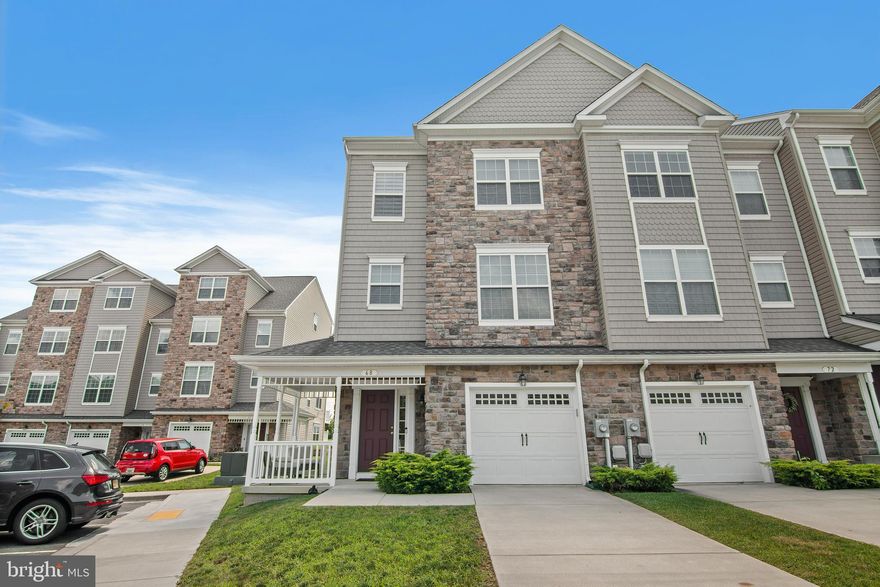 Welcome to this exquisite luxury end unit garage townhome, a true gem nestled in a tranquil neighborhood. Built just four years ago, this immaculate residence boasts sophistication and elegance at every turn. With three spacious bedrooms, including a master suite, and two full baths complemented by two well-appointed half baths, comfort and convenience are paramount.

The modern kitchen is a chef's dream, adorned with gleaming stainless steel appliances and granite countertops, perfect for preparing culinary delights. The lower level offers a cozy family room, providing a seamless connection to the outdoors through a walk-out patio. A charming front porch adds to the allure of this remarkable home, creating the ideal setting for relaxation and entertaining. Embrace the luxury lifestyle in this captivating property, where contemporary design and thoughtful features harmonize effortlessly to create an exceptional living experience.