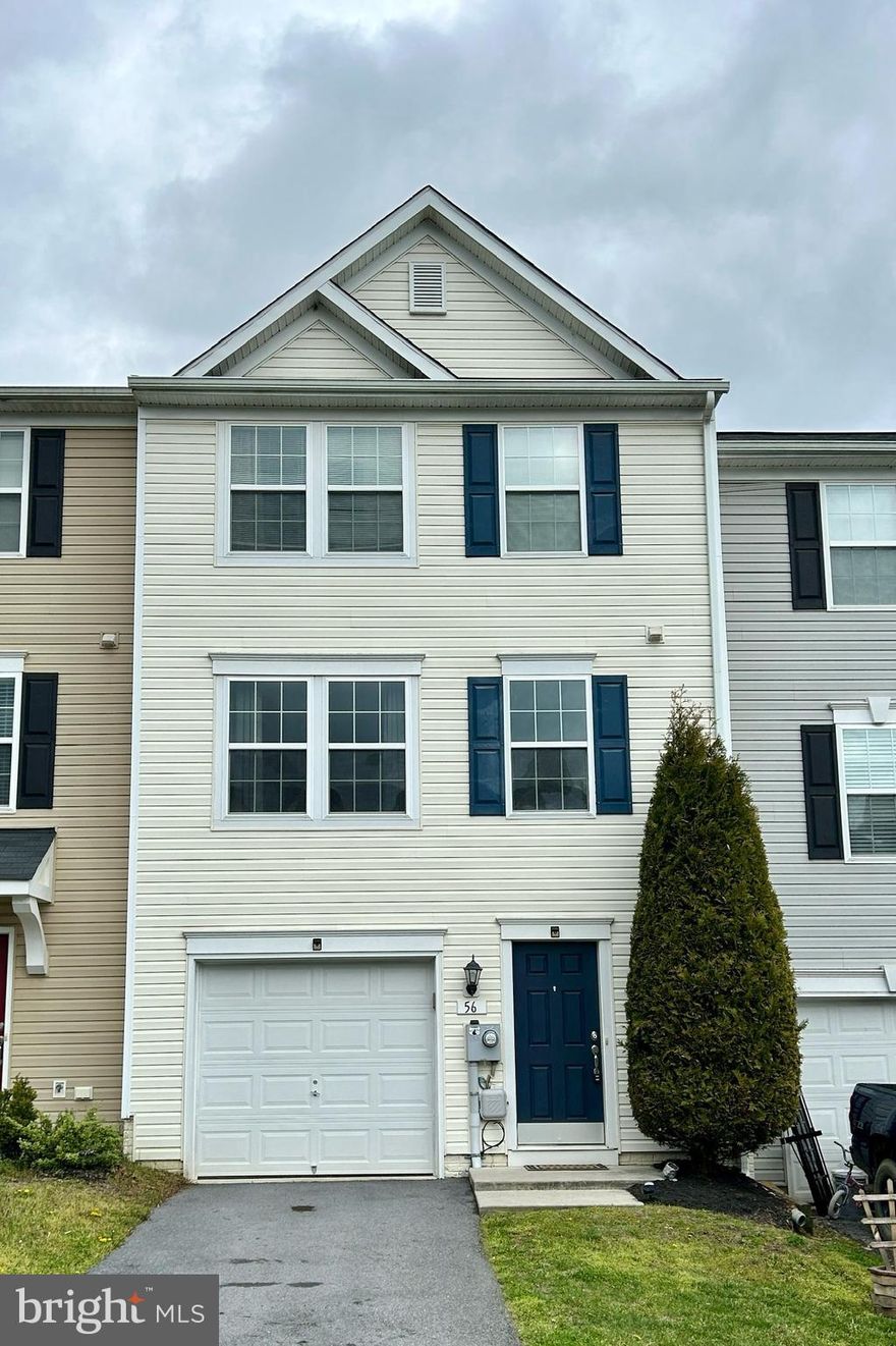 Located in the charming town of Hedgesville, this well-kept townhome boasts three levels of comfortable living space. The finished basement offers a convenient laundry room and a half bath, and a perfect spot for a home office, gaming room or den, along with access to the attached one-car garage.

On the second level, you'll find a spacious living room perfect for relaxation, and a well-equipped kitchen/dining combo ideal for entertaining. The dining area leads out to a sizable 16 x 12 deck, offering a peaceful perch for grilling, or having morning coffee.

Ascending to the third level, you'll discover a generously sized primary bedroom featuring a private bath with a separate shower and soaking tub for ultimate relaxation. Additionally, this level includes two cozy bedrooms and a full bath in the hallway, providing ample space for family or guests. With its convenient layout and attractive features, this townhome offers comfortable living arrangement.

Located near shopping, schools, with proximity off Route 9 West and I-81.  Take a look today. You'll be glad that you did.