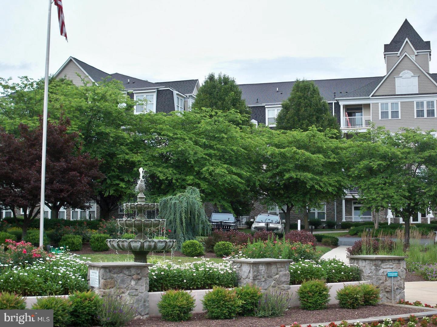 This is a lovely 2 bedroom, 2 bath condominium in the Park Place Condominium Association within the community of Wormans Mill. The condo is inclusive of hardwood floors in living/dining area, kitchen, and both bedrooms. In 2017, the kitchen appliances were updated with Whirlpool appliances, quartz counter tops, stainless steel sink and new faucet and garbage disposal. The light fixtures in the condo were replaced; all with energy saving LED bulbs. The Master Bath was also remodeled in 2017 with new quartz counter tops, double sinks and faucets, new medicine cabinets and a new walk in shower with shower head/hand sprayer and Kohler sliding glass doors. The gas fireplace insert was replaced in 2018 and is inclusive of remote control operation. The hot water heater was replaced in 2019. The entire condo was freshly painted in 2017. This condo is on the first floor but is above ground level with a balcony overlooking trees, water, and lawn area. The condo includes one underground indoor garage space (#61) and a separate storage unit (#102). Within walking distance (as well as ample parking) the Wormans Mill Community offers many amenities, including a clubhouse with a library, exercise room, cardroom, party room, a billiard room with pool table. The clubhouse is surrounded with a family pool, a lap pool, and a baby pool; a putting green, tennis court, (inclusive of pickle ball courts), and basketball courts. There are numerous walking paths throughout the community, a village center with up and coming restaurants and small commercial venues.