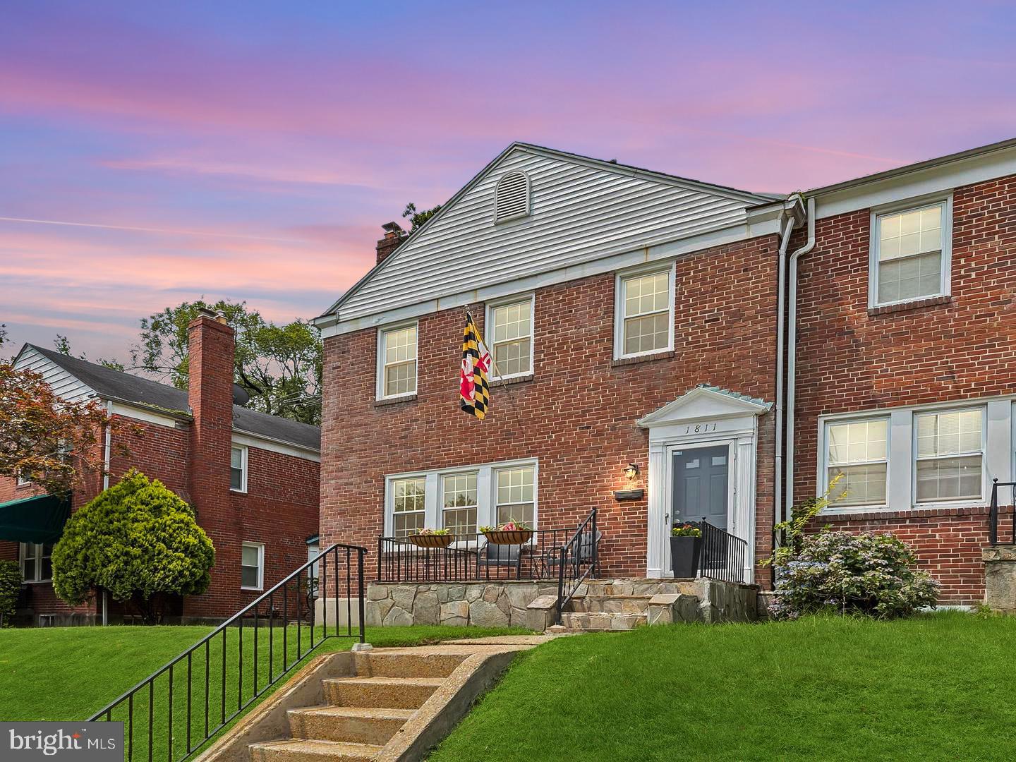 Welcome to this move-in-ready 3-bedroom, 2-bath end-of-group rowhome located in the Loch Raven Village community. Step inside to an open main level featuring rich, just refinished hardwood floors (2021) and a modern, neutral color palette. The entry alcove leads into a sunny living room boasting a wood-burning fireplace, which transitions into the dining room through a classic arched entry. The light-filled dining space is accented with crown molding, chair rail, and a bay window. The eat-in kitchen includes recessed lighting, luxury vinyl tile flooring, stainless steel appliances, highlighted by a decorative backsplash. Upstairs, the primary bedroom offers comfort with plush carpeting and chair rail detailing, along with two additional bedrooms. The hall bath includes a ceramic tile surround and a tub/shower combination. The lower level provides versatile space—perfect for a rec room or game area—with knotty pine paneling that adds warmth and character. A full bath, laundry area, with generous storage space round out the lower level. Outside, the fenced rear yard presents a variety of possibilities, whether you're looking to garden, create a play area for pets, or host outdoor gatherings. Recent updates include new windows (2021), a sump pump (2022), HVAC system (2023), and a slate roof that has been carefully maintained each year. This home is ready for you to move in and make it your own.
Note: Select interior photos have been virtually staged