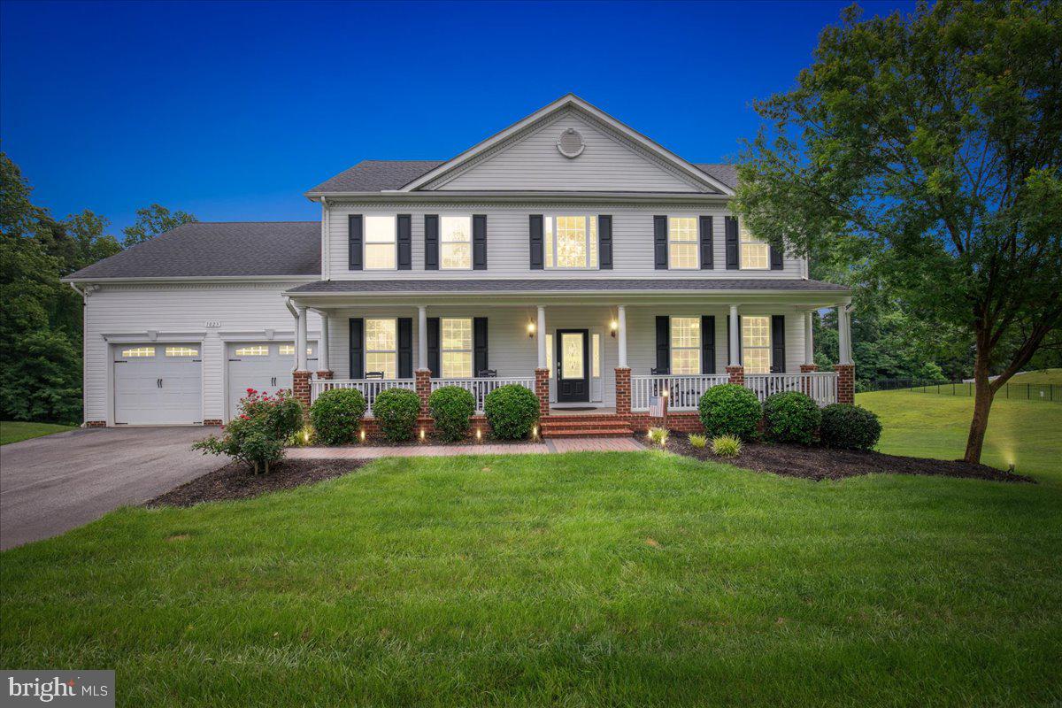 Homes rarely come on the market in the coveted Farms at Hunting Creek. With over 170 homes all on 1 acre or more, enjoy tree lined sidewalks, a small lake to throw in a line, a playground, gazebo, basketball court & a soccer field. The community offers the fun of food trucks, and holiday decorating in like none other. Zoned for award winning Plum Point Middle, and HUNTINGTOWN HS, close to Prince Frederick for shopping, and an easy commute to DC, Annapolis, Andrews AFB, Patuxent River, etc. Do not miss your chance to see this beautiful home and call it your own. With over 4500 sq ft of living space, 5 bedrooms, & 3.5 baths, you will have room to spread out. In Quality Built Home's Pendelton model, you will be greeted by a soaring 2 story foyer, gleaming real hardwood floors that span almost the entire main level. To your right, a private office with french doors. To your left. an a oversized dining room with custom molding, room for a large table, and a hutch perfect for all of your family gatherings. Love to cook? The "grand" kitchen is well appointed with loads of prep space, a large island, granite counters, upgraded maple cabinets, & under cabinet lighting make the space warm and inviting. Also find a large pantry, stainless steel appliances & a new refrigerator that makes CRAFT ICE!. The open concept flows into the sunlit family room, where you can cuddle up to the gas fireplace. Walk up your beautiful oak staircase to the upper level where you will find your laundry room - no need to bring that up & down the stairs! The primary suite, is definitely a suite. Vaulted ceilings, oversized sitting room, hallway of 3 closets. This opens to your gorgeous bathroom, with dual vanities, huge tiled shower with seat dual shower heads. Relax after a long day in your inviting soaking tub. The other 3 secondary bedrooms on the upper level are all great size. Like to entertain? The lower level is fully equipped for that. Enjoy a movie on the big screen or cue up your pool stick for some fun. Here you will also find a fifth bedroom and full bath, a large unfinished storage area and a small deck off the back. Included in the sale - a state of the art security camera system! 4 K 16 channel NVR with 12 hardwired cameras that can be viewed remotely via PC or via cell phone app. All appliances are energy efficient, on demand TANKLESS gas water heater, and the 500 gallon propane tank is OWNED so you can have your choice of where to purchase gas. The yard backs to the woods, and the septic system is on the left side of the house, so there’s plenty of room to build your dream pool! The front yard also has full IRRIGATION to keep your grass looking green and lush. The driveway has an extra space all your cars, and don’t miss the custom hardscaped front walk leading to your front porch where you can sip your coffee & listen to the birds chirp. This home is a beauty! Set up your showing today.