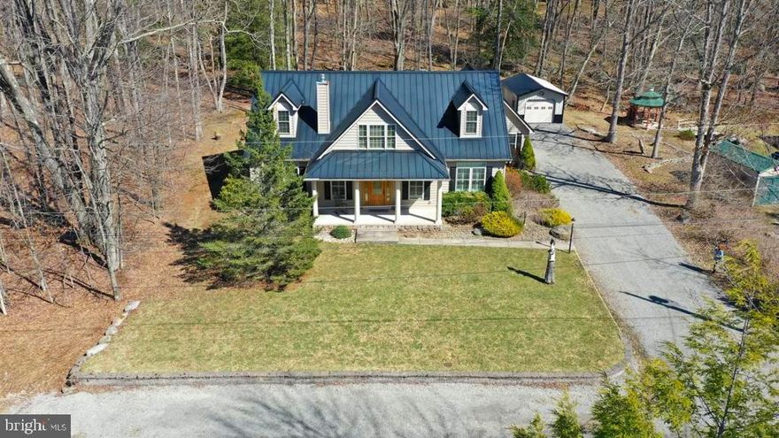 WELCOME HOME! THIS LAKE VIEW CRAFTSMAN STYLE 4 Bedroom - 2 1/2 Bath Home on 1.27 Acres is Located in the Prestigious Alpine Lake Resort! Highly Sought-After LOCATION. FINEST of DETAILS Throughout! Privately situated on an ATTRACTIVE & Quiet Street, Take in the Wonders of a Starry Sky on those clear evenings. Home Boasts over 2,900 sq. ft. of Interior living space. Take a Stroll down to the Lake WITHIN 500+/- feet away. Level Lot with Extensive Landscaping. The covered front porch features large white columns & views of Alpine Lake; concrete walk-way & concrete back patio. When YOU walk thru the front door you will FEEL the Warmth this home offers. Open Concept, Gorgeous Hardwood Floors on the main level. Custom Plantation Blinds/Shutters bring an Air of  Luxury and no detail has been left out. Gourmet Kitchen/Granite countertops, breakfast bar, hickory custom cabinets, butlers pantry with attached laundry room, stainless steel appliances. Entertain Family & Friends on those Speical Holiday Gatherings in the spacious dining area. Beautiful Cathedral Pine tongue/groove ceilings, the gas fireplace sets the ambience for a COZY Evening In. Primary en-suite on the main level, beautiful primary bath with 2 walk-in closets, soaking tub, tiled walk-in shower & double bowl vanity. If you work from home enjoy (PRODIGY) Fiber Optics Internet. Spacious  Enclosed 3 season screened-in porch to take in the Natural Beauty that surrounds you. Large gathering room in the upper level along with 2 bedrooms & full bath.  Attached 2 1/2 car garage with extra storage & also a detached 3rd car garage.  Enjoy Alpine Lakes Amenities: 24/7 Security,  Indoor heated pool, spacious fitness room, relax at the sandy beach, tennis/pickle ball/basketball courts, Boathouse with a boat ramp, rent a kayak/canoe/paddle boat & take in the beautiful scenery all around you. Paved roads throughout, 18 hole Golf Membership available, if you are an outdoor enthusiast there are many hiking/biking & cross country ski trails to enjoy throughout the year. Call to Schedule an appointment to view this SPECTACULAR PROPERTY!