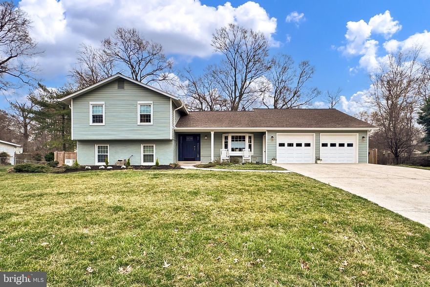 OPEN HOUSE HAS BEEN CANCELLED.
Discover this beautifully renovated 4 bedroom, 3 bath home nestled in the historic and highly sought-after Mount Vernon community in Alexandria, Virginia. This expansive split-level home offers a perfect blend of contemporary design and sophisticated finishes, ideal for modern living. The updated exterior makes a lasting first impression with its freshly painted siding, charming courtyard-style patio, and fenced-in yard featuring a reclaimed wood shed. A customized two-car garage with an adjoining exercise room adds both convenience and versatility. Inside, you'll be greeted by elegant hardwood flooring, serene neutral paint tones, and a cozy fireplace set against a striking brick accent wall. Large windows bathe the home with natural light, enhancing its warm and inviting atmosphere. The gourmet kitchen and spa-inspired baths perfectly blend form and function, providing a truly exceptional living experience.

Step inside and experience the charm that makes this home truly special! The formal living room welcomes you with a stunning wall of windows and elegant French doors, inviting you to the enchanting garden and expansive multi-area patio — perfect for effortless indoor-outdoor living.

Moving into the kitchen, you'll discover a chef's dream come true — luxurious quartz countertops, a sprawling ten-foot center island with a breakfast bar, and a striking stone tile backsplash. New premium appliances, including an induction gas range with a split oven and convection option, make cooking a delight. The adjacent dining area is equally inviting, featuring a stylish built-in coffee bar with a beverage chiller — the perfect setup for effortless entertaining.

Upstairs, the primary suite offers a tranquil retreat, featuring a custom walk-in dressing room and an updated spa-inspired bath. This luxurious space boasts a dual-sink vanity and an oversized ultra shower with three shower heads, including a soothing rainmaker. Two additional generously sized bedrooms share a beautifully renovated hall bath, completing this level with both comfort and style.

The lower level offers substantial additional living space, featuring a cozy family room with a wood-burning fireplace — perfect for relaxing evenings. This level also includes a well-appointed laundry and mud room, a spacious fourth bedroom, and a meticulously updated full bath, providing both comfort and convenience.

Additional storage and bonus spaces elevate this home's functionality, including a finished attic above the garage and a dedicated workout area featuring padded floors and a wall mirror at the back of the garage. Thoughtful upgrades such as replacement thermal windows, a whole-house Generac generator, and a newer roof provide added peace of mind.

Ideally situated near I-95, GW Parkway, the Metro, and the vibrant shopping and dining scene of Old Town Alexandria, this home offers unbeatable convenience. Outdoor and history enthusiasts will appreciate the proximity to the iconic Mount Vernon mansion and estate, along with the scenic Potomac River and numerous local parks.

This home perfectly blends style, comfort, and convenience — your dream home is ready and waiting!