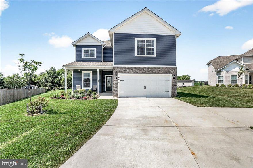 Welcome to 10042 Roulette Dr.—a striking example of modern luxury nestled in the sought-after Claggett’s Mill 11 subdivision of Hagerstown, MD. Built in 2022 and meticulously maintained, this 5-bedroom, 3-bath home offers over 3,190 sq ft of stunning above-ground living space designed for both grandeur and comfort. Set on a premier oversized ½-acre lot, this home greets you with a charming covered front porch and an extra-long driveway that easily accommodates up to 10 vehicles, leading to an oversized 2-car garage. Inside, the heart of the home is the breathtaking living room, where a soaring ceiling, custom fireplace with built-in shelving and a handcrafted mantel, and abundant natural light come together to create a truly inviting space. The living room's additional ductless mini-split system ensures comfort year-round. The open-concept layout flows into a gourmet kitchen with granite countertops, stainless steel appliances, and an expansive dining room perfect for hosting. The main-level primary suite features a spa-like bath with a soaker tub, oversized walk-in shower, and a generous walk-in closet. Upstairs, you'll find four spacious bedrooms—each with walk-in closets—a oversized full bath with double sinks, and a separate family room, perfect for relaxation or play. Enjoy peaceful farmland views, fenced in back yard and quiet privacy from your back patio, while being just minutes from I-81, I-70, shopping, dining, and the Hagerstown Premium Outlets. With walking trails, a tot lot, and picnic areas nearby, this home blends suburban serenity with convenient access to Frederick, MD and 30 minutes to I-270 interchange to Washington, DC. Best of all No City Taxes and low HOA fees. This is more than a house—this is your next chapter.