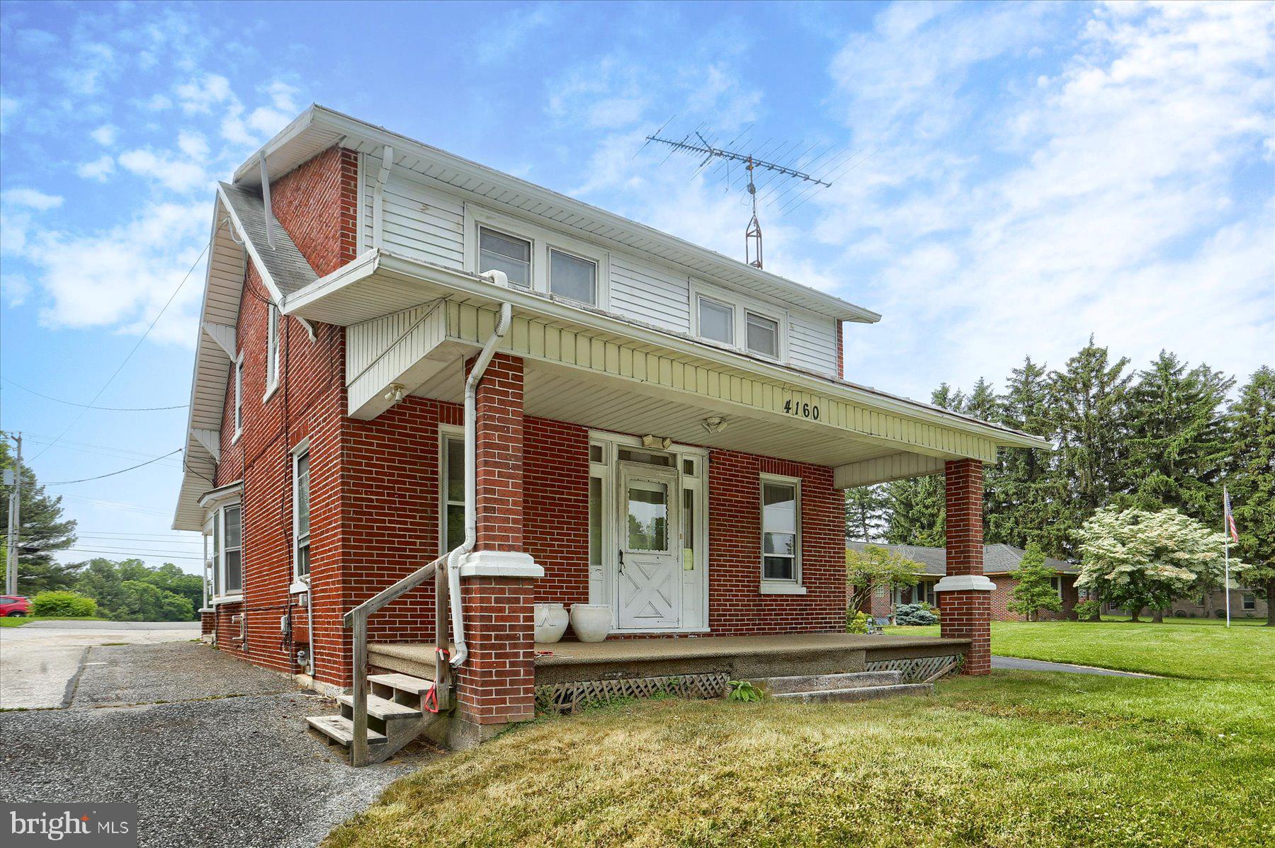 Commercially zoned, but has residential potential. This brick 2 story with inviting front porch leading to a living room, and bright eat-in kitchen. Neutral paint & floors throughout. First floor half bath. Second floor with hardwoods, 3 bedrooms and full bath. Basement for storage and a detached garage. Lots of possibilities with this property! Don't miss out!