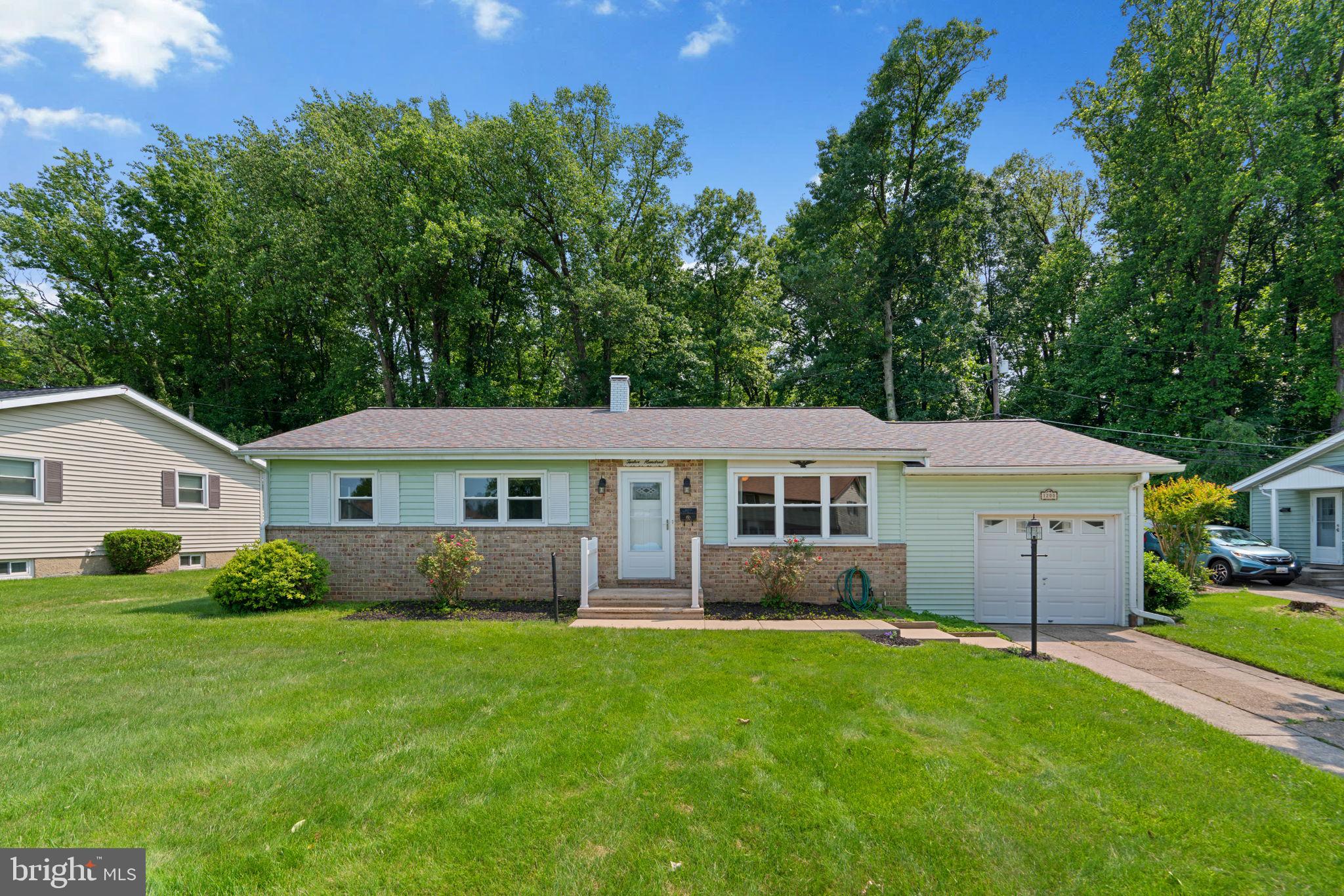 Beautifully maintained, this charming ranch-style home offers 2,400 square feet, 3 bedrooms, 2 full baths, 1 half bath, and a 1-car garage nestled in desirable Westview Park. Hardwood floors flow throughout the open-concept main level, beginning in the bright and spacious living room, filled with natural light. The living room effortlessly transitions into the formal dining room, which features delightful corner built-ins and sliding glass doors that open to the backyard, creating the perfect space for everyday living and entertaining. Adjacent to the dining room is the updated eat-in kitchen, thoughtfully designed with stainless steel appliances, a stylish backsplash, ample cabinetry and Granite countertops, and direct access to the garage for added convenience. The main level continues with three well-sized bedrooms and two remodeled full bathrooms, including an inviting primary suite with attached full bath. The lower level offers a generous recreation room with a dry bar, half bath, workshop area, laundry space, and walk-up rear exterior access. Enjoy outdoor living in the private backyard, which backs to mature trees and features a covered patio, a deck area, and a storage shed. Additional highlights in the last five years include a newer roof, windows, doors and brand new hot water heater, providing peace of mind and energy efficiency. Great convenient location and only a five minute walk to the Westview recreation area and playground. Seller needs rent back. One year home warranty included.