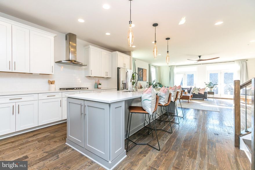 **OPEN HOUSES CANCELLED**   Over 4,000 SF of sophisticated and spacious living.   Every space Wows!  Located in Greenleigh: metropolitan living  offering on site restaurants, shops, pool, fitness center, club house, dog park, jogging trails, and more!  Rare opportunity to avoid construction time and NO COSTLY "NEW CONSTRUCTION" FEES! Delight in every room of this 4-level urban gem featuring  curated design upgrades and modern performance for the needs of 2020 and beyond.   THREE MASTER SUITES provide versatility and ease for use as bedrooms, rec rooms, office space or more.  The sprawling beauty of the open kitchen, jeweled with Edison lighting and sparkling appliances invites you to the comfort of prepping and dining each and every day.  Open on either side to large living and dining rooms which expand to outdoor space; this level fulfills any function for work & play.  2nd Upper Level opens to rooftop terrace and provides full bath.  Lower level has large bedroom, en suite bath and huge family room for even more space to entertain, workout, or let your imagination take hold.  Enjoy even more amenities within minutes - easy commuter access, live entertainment at Poole's Island Brewing, outdoor recreation.... Baltimore Co. High Performing Home tax credit available for one more year.  Lock in your extremely LOW interest rate NOW and grab this inspired, luxury townhome before its gone!