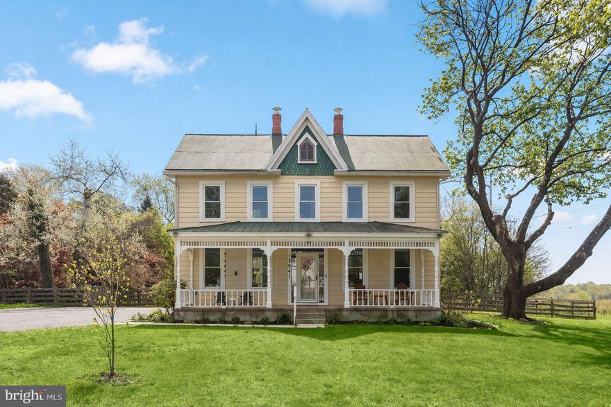 Scenic pastures in sought-after horse country set the stage for this beautifully updated modern farmhouse, where timeless turn-of-the-century character meets today’s comforts and expansive outdoor living. A welcoming front porch invites you inside to the main level, where original hardwood floors flow seamlessly throughout. A versatile office or bedroom is filled with natural light and enhanced by detailed window trim and crown molding.  The kitchen is both functional and picturesque, featuring ceramic tile flooring, 42” cabinetry, a pantry cabinet, stainless steel appliances, and sweeping pastoral views. Just off the kitchen, the dining room showcases original flooring and provides an effortless flow for entertaining. The living room offers a cozy retreat with plush carpeting, crown molding, built-in bookcases, and a charming window seat framed by a picture window overlooking the serene landscape.  The primary suite serves as a private haven, highlighted by modern flooring, a walk-in closet, a dedicated vanity area, and an en-suite bath complete with a double vanity, jetted soaking tub, and custom organization. Two additional spacious bedrooms with hardwood flooring and crown molding, along with a hall bath, complete the upper level. A sizable floored attic presents endless possibilities for storage or future expansion.  Outdoor living is equally impressive with a deck overlooking the tranquil setting, a fenced area ideal for pets or gardening, and a storage shed perfect for a workshop or hobby space. Conveniently located near major commuter routes, including MD-80 and I-70, this exceptional property offers the perfect blend of rural charm and accessibility.  Recent updates and improvements enhance both comfort and functionality, including a full suite of appliances with a refrigerator, dishwasher, microwave, washer, and dryer, along with a water heater replaced in 2024. Interior upgrades feature ceiling fans in the living room and bedrooms, custom closet systems throughout, new carpet in the living room and vanity area, hardwood flooring in the primary bedroom, tile flooring in the primary bath, and a fully remodeled powder room. Additional improvements include upgraded kitchen piping with PEX, a waterline to the refrigerator, new storm and entry doors, new deck doors, an electrical service run to the barn, a newly paved driveway, and a septic system pumped in January 2026.