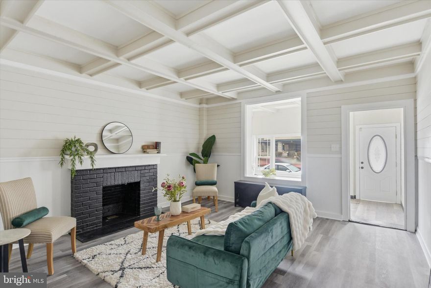 Welcome to 2439 N. 2nd Street in Harrisburg - a beautifully refreshed semi-detached home blending timeless character with today’s modern finishes. This home has received a full glow-up and is completely move-in ready for its next chapter. Step through the warm and inviting enclosed front porch, the perfect flex space for a home office, reading nook, or morning coffee retreat. From there, you’ll enter the spacious living room featuring a charming fireplace, elegant wainscoting, and coffered ceilings that continue into the formal dining room, creating a classic and elevated feel ideal for everyday living and entertaining. The brand-new kitchen is both chic and highly functional, showcasing quartz countertops, stainless steel appliances, stylish cabinetry, and two pantry areas offering exceptional storage. Just off the kitchen, you’ll find a convenient mudroom and a newly added half bath, thoughtfully designed for practicality. The finished lower level expands your living space and includes an additional new half bath, providing flexibility for a family room, workout space, hobby area, or guest overflow. Upstairs, the second floor offers three nicely sized bedrooms and an upgraded full bathroom, combining comfort and modern updates. Additional improvements include a roof installed in 2011 and replacement windows in 2019, adding peace of mind. Outside, enjoy a spacious backyard complete with a firepit area perfect for relaxing evenings or gatherings with friends. The property also features a rare two-car detached garage, providing valuable off-street parking and additional storage. With its blend of original architectural detail, thoughtful renovations, and functional layout, 2439 N. 2nd Street is ready to welcome its next owners home.