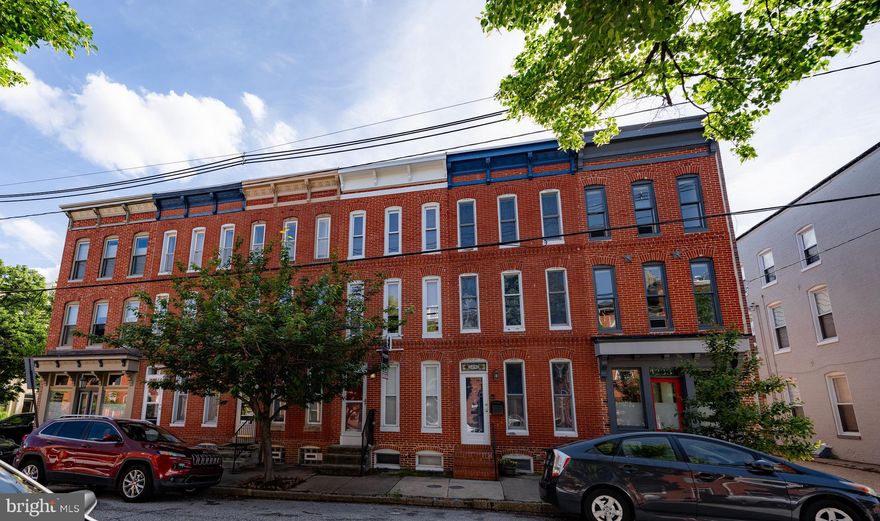 **Open House Canceled for May 18th, Sellers have accepted offer to purchase. **

Introducing 1229 Riverside Avenue.  

This meticulously maintained home on one of the prettiest and most sought-after blocks in Baltimore boasts three bedrooms, two full bathrooms, and a convenient half bath on the first level. 
The finished basement offers versatile space for a workout room, den, or office. 

Upon entering the main level, you're greeted by a welcoming living room adorned with beautiful hardwood floors, a cozy fireplace, exposed brick accent walls, and custom shelving.
The fully equipped kitchen features ample counter space and leads to a rear half bath and large parking pad accessible from the alley. Directly across from the alley is the adorable, Henry Street park, a great meeting place for all locals both human and canine.  

Upstairs, two bedrooms share a central bathroom with a laundry room for added convenience. The top floor hosts the luxurious owner's suite, complete with a spacious bathroom featuring a separate shower, Jacuzzi tub, and double sinks, along with a sizable customized walk-in closet. Step outside to the double deck and revel in breathtaking 360-degree views of Baltimore's classic skyline, inner harbor, M&T Bank Stadium, Camden Yards including the iconic and beloved Domino Sugar sign.  You and your guests will be awestruck and inspired with these views.
Don't miss out on this opportunity to own a home that combines exceptional vistas with impeccable finishes and coveted parking in one of the best locations in the heart of Federal Hill.