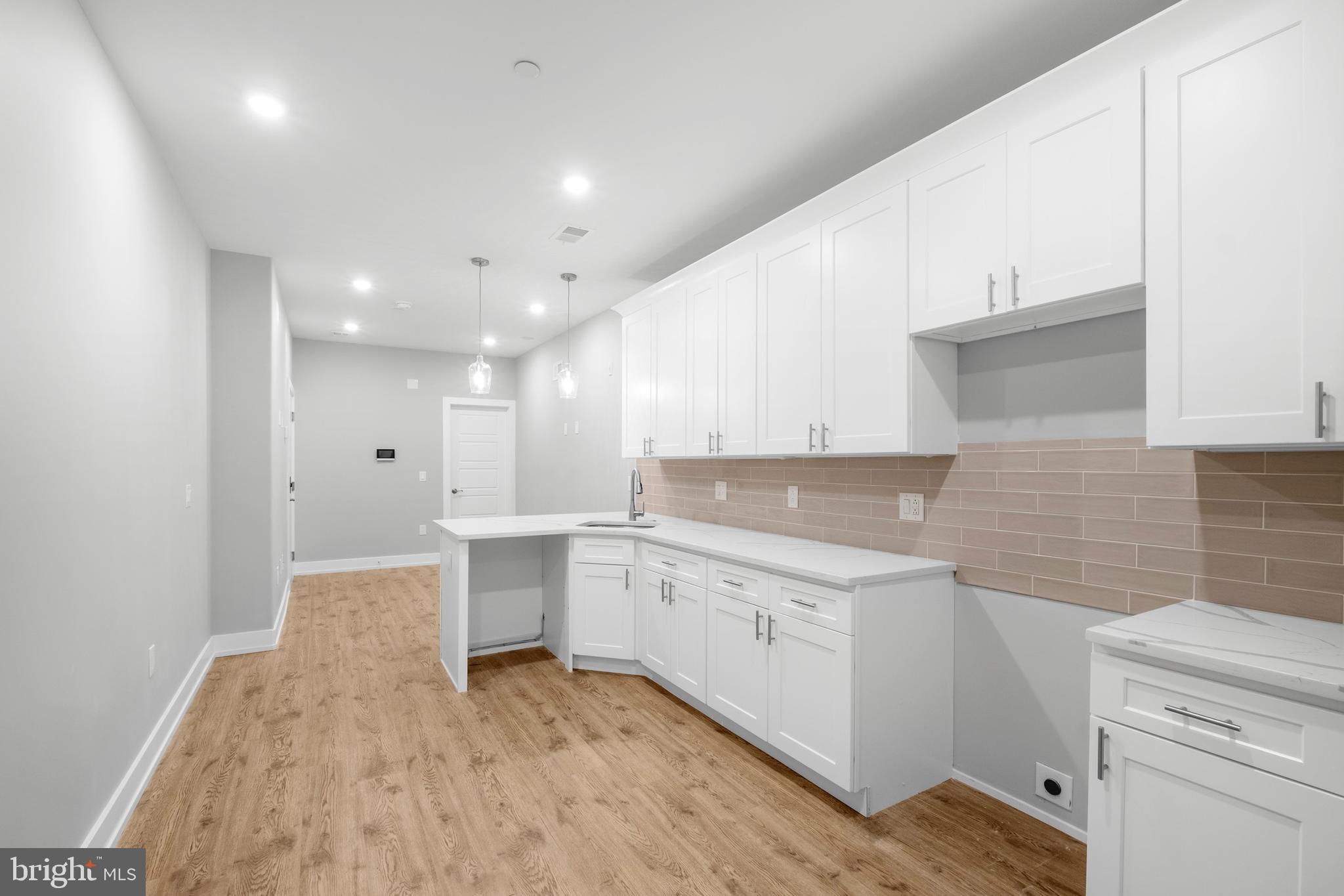 Unlock immediate income potential with this spectacular brand-new 4-unit apartment building! Each unit offers self-contained living with luxurious kitchens, elegant bathrooms, hardwood floors throughout, and in-unit laundry. Call now to explore special financing opportunities!
