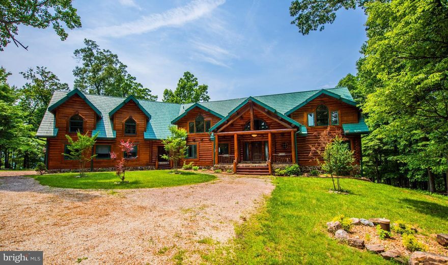 UNBELIEVABLE CUSTOM LOG HOME WITH VIEWS TO STRASBURG VA & ACCESS TO PRIVATE LAKE!!! Views abound from the PEACE & QUITE afforded by Various Balconies, Porches & a Sprawling Deck. The 2 story Great Room w/Stone Fireplace & Massive Douglas Fir Logs will take your breath away. Too Many Features to list here, including the full unfinished walk out basement. Still some Finishing Touches in Progress.