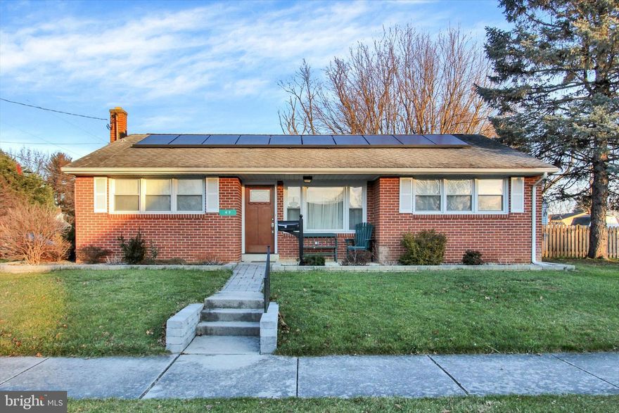 COZY, ALL BRICK 3 BR, 1 BA Home on Corner Lot in Littlestown Area School District.  Hardwood Floors throughout, with Main Level Laundry, Solar Panels, Updated Kitchen and Bath, Stainless Steel Appliances, Replacement Windows, Washer/Dryer Included, and so much more.  The glass door off the dining room is ideal for immediate access to the Fenced-in Backyard.  The unfinished basement, the attached oversized garage, and the storage shed afford convenient storage space right on the premises.  The level lawn is polished off with well-defined garden beds that frame the exterior of the home.  Solar panels are leased and offset the utility costs; home is heated by natural gas; oven/range is electric.  Schedule your showing so you don't miss the chance to make this MOVE IN READY home yours!