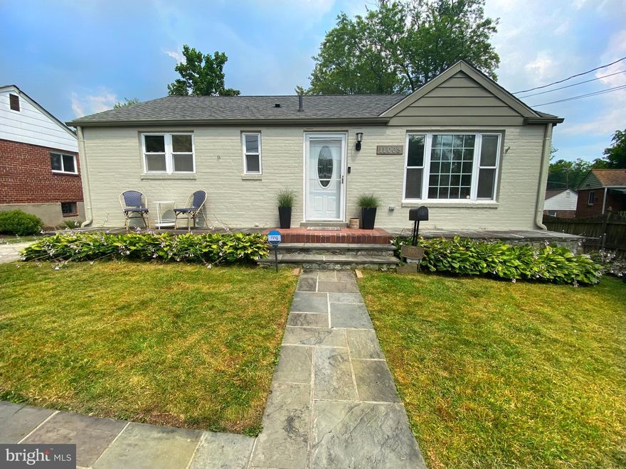 Welcome to 11003 Burnley Terrace, a charming rambler just steps away from shops, restaurants and the Wheaton metro stop. This home is much larger than it appears from the trim and tidy front yard, boasting 5 spacious bedrooms, 2 full bathrooms and excellent living space. 

Enter the home to the sun-drenched open living and dining area, complete with an oversized window. Just past the dining area, the newly renovated kitchen features brand-new stainless steel appliances, sleek quartz countertops, and freshly painted cabinets. The open living space is an ideal layout for hosting large or intimate gatherings. From the kitchen, step into the four-season family room. Originally a screened-in porch, this room has been transformed with panoramic windows into a serene setting all year long. The back deck is also accessible from this four-season room. Three bright bedrooms and a fully renovated bathroom complete the main level. *Hardwoods are still under the carpet in the upstairs bedrooms!*

The lower level offers a vast recreation room, with an HD projector and plenty of space for games or entertainment systems. The spacious fourth bedroom also has access to the backyard. The fifth and final bedroom has built-in shelves making it perfect for a home office. A sizable laundry room with additional storage space is also located on the lower level. 

Finally, the lush and fully fenced backyard is the perfect oasis. The back deck provides an excellent spot for grilling and dining al fresco, with plenty of space in the yard for lawn games, gardening, and more. 11003 Burnley Terrace is wonderfully convenient to the metro, commuter routes, Costco, the Wheaton Mall, and more. Don’t miss this charming rambler in Silver Spring!