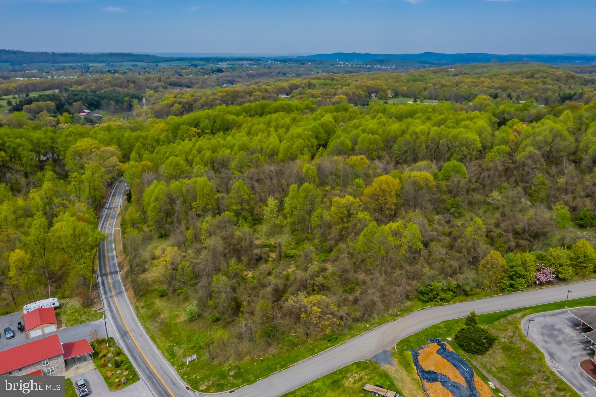 Twenty one acres of sloping wooded land. Clean and Green. Join Fulton Bank, Rutters, and Dunkin donuts. Regional Commercial Office, Zoning RCO